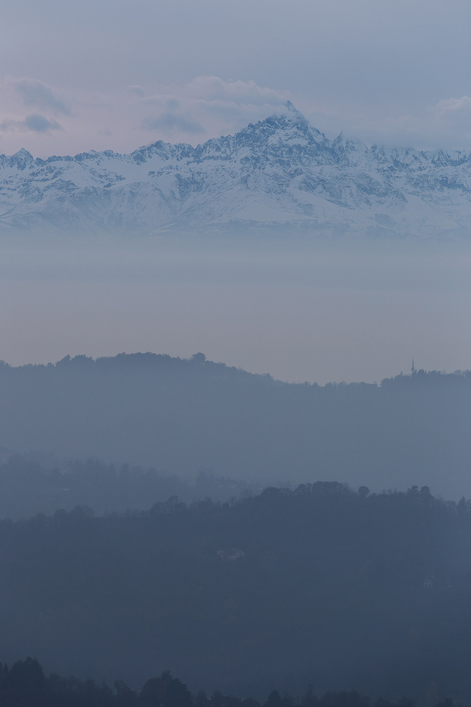 The monviso between the fog and the clouds