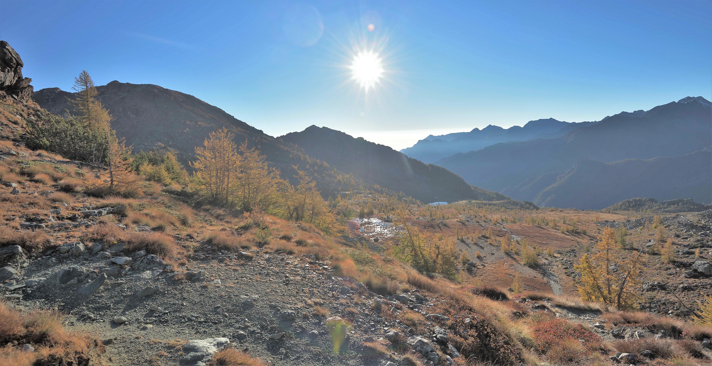 Behind me the sun is illuminating the valley