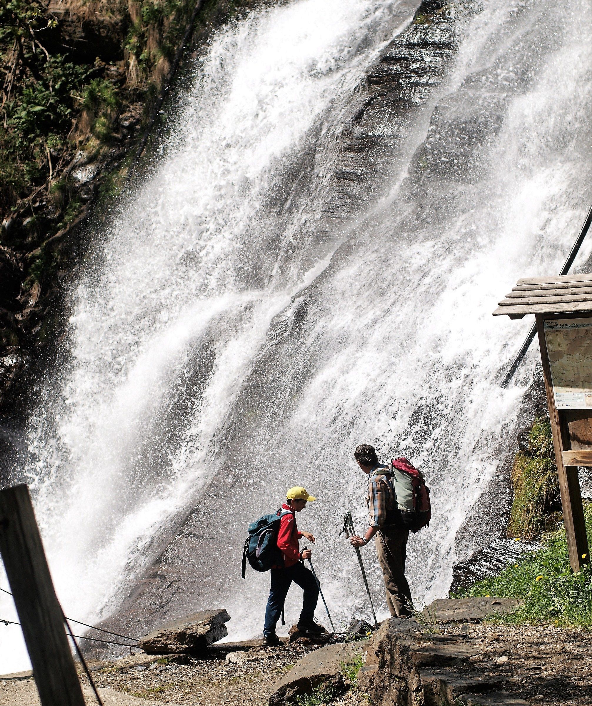 The Rigoni and the PUP in front of the waterfall.