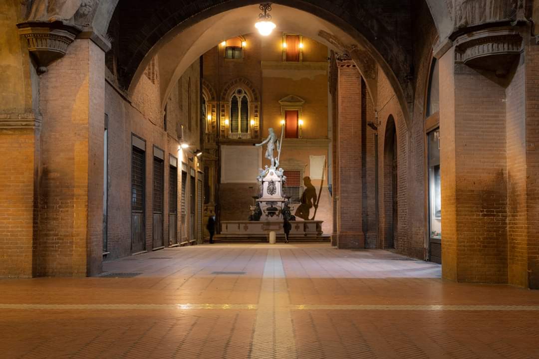 The Neptune of Bologna seen from the Portico of the Podest&a...