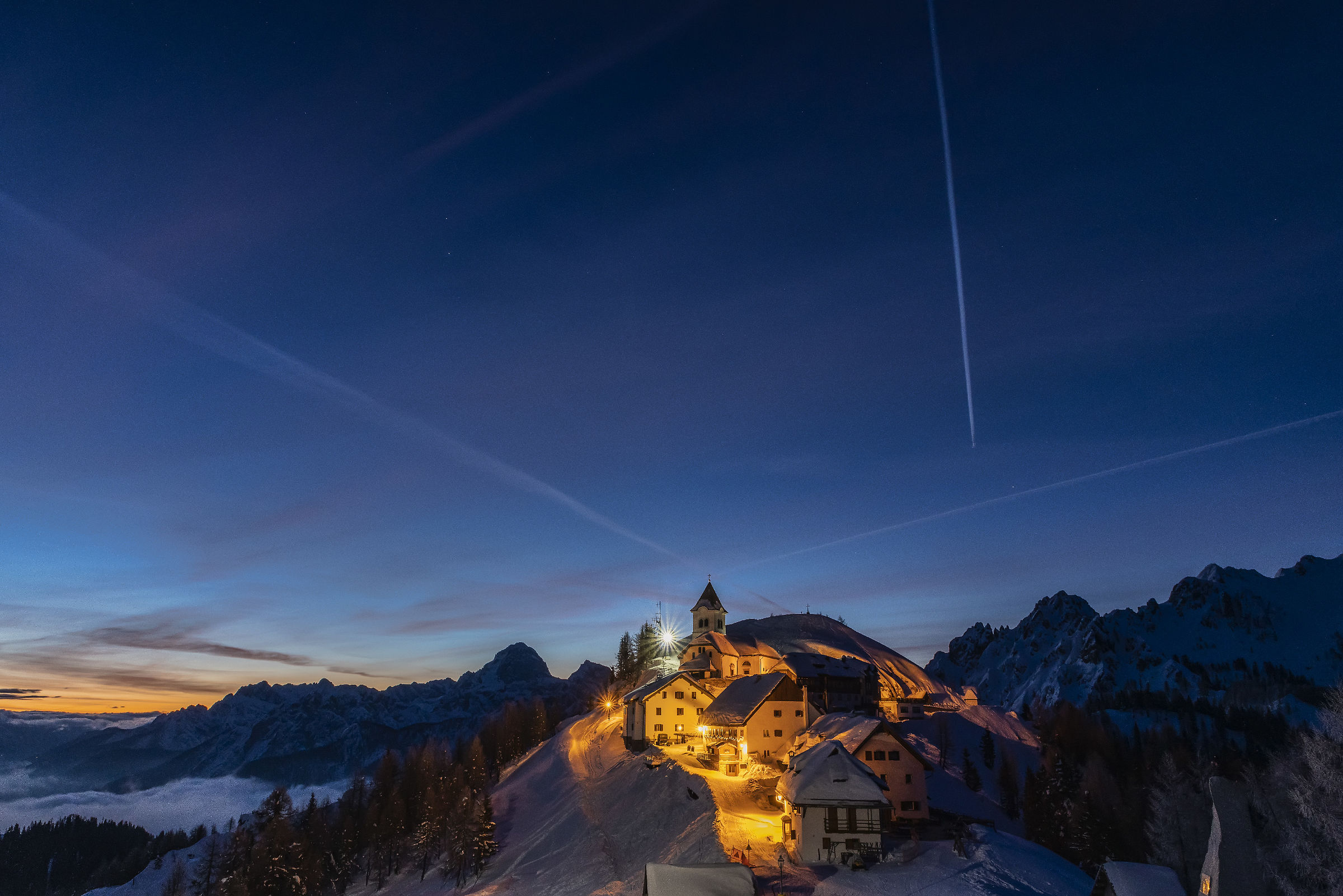 Sunrise arrives at the Lussari