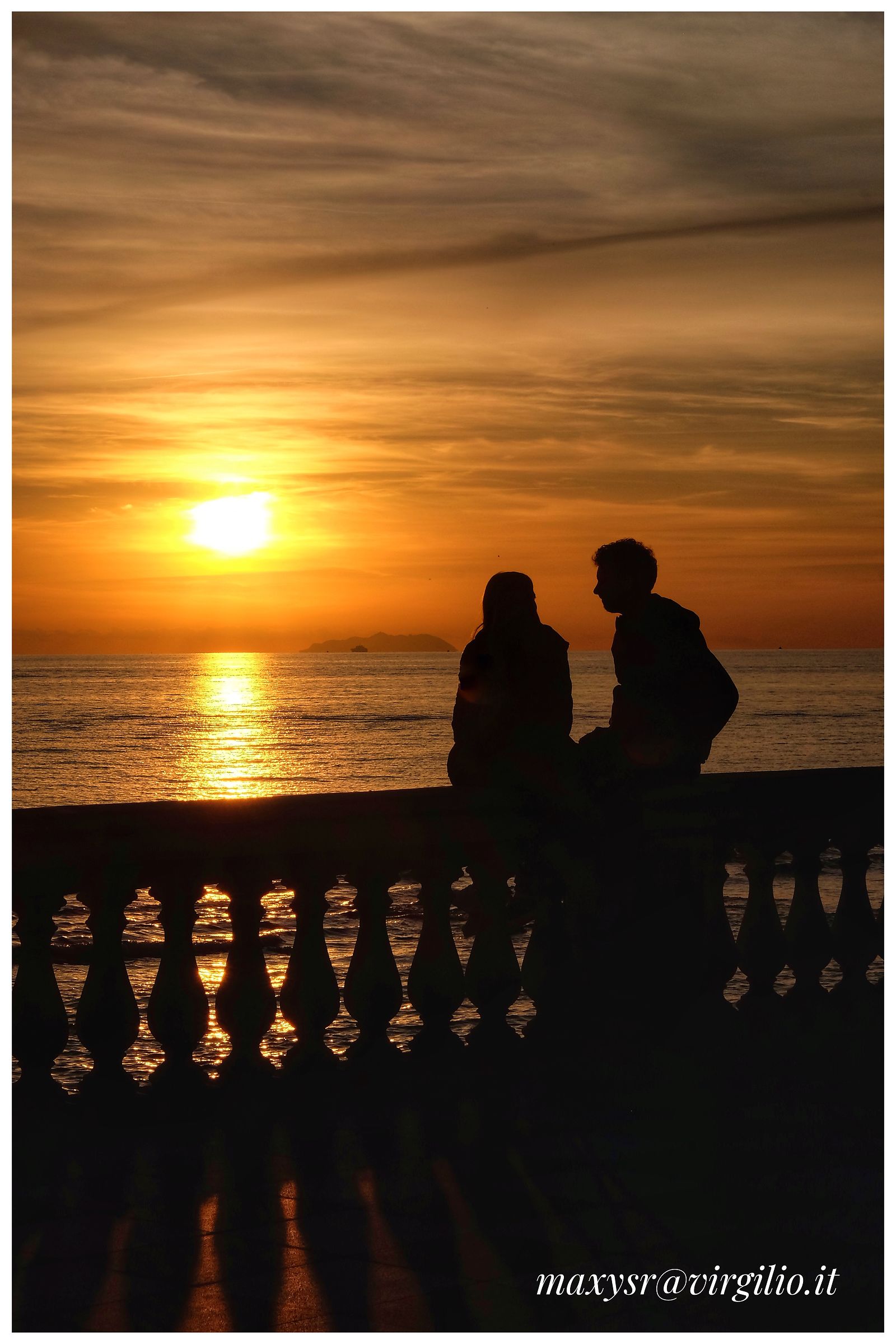 Crouched to listen to the sea..