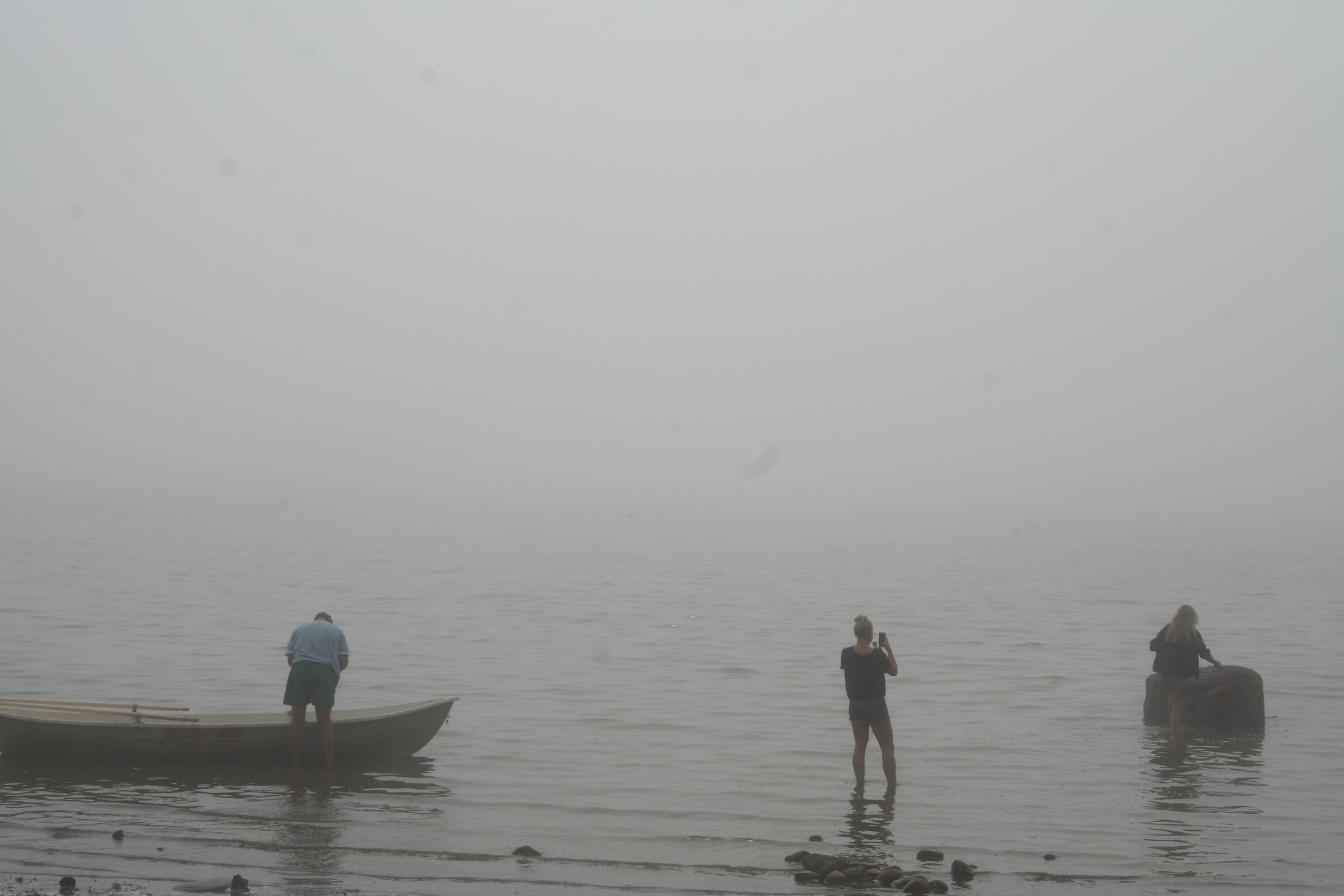 Men, water and fog