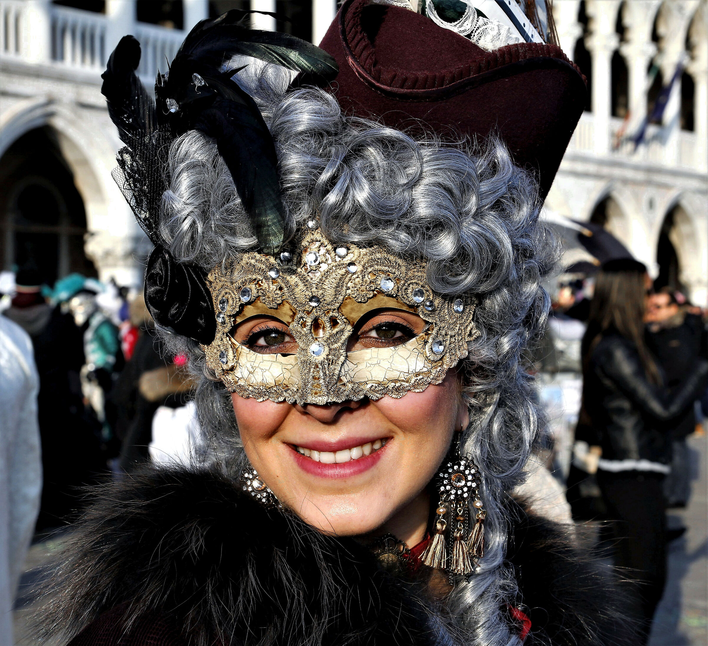 with a smile.... Uncertain.