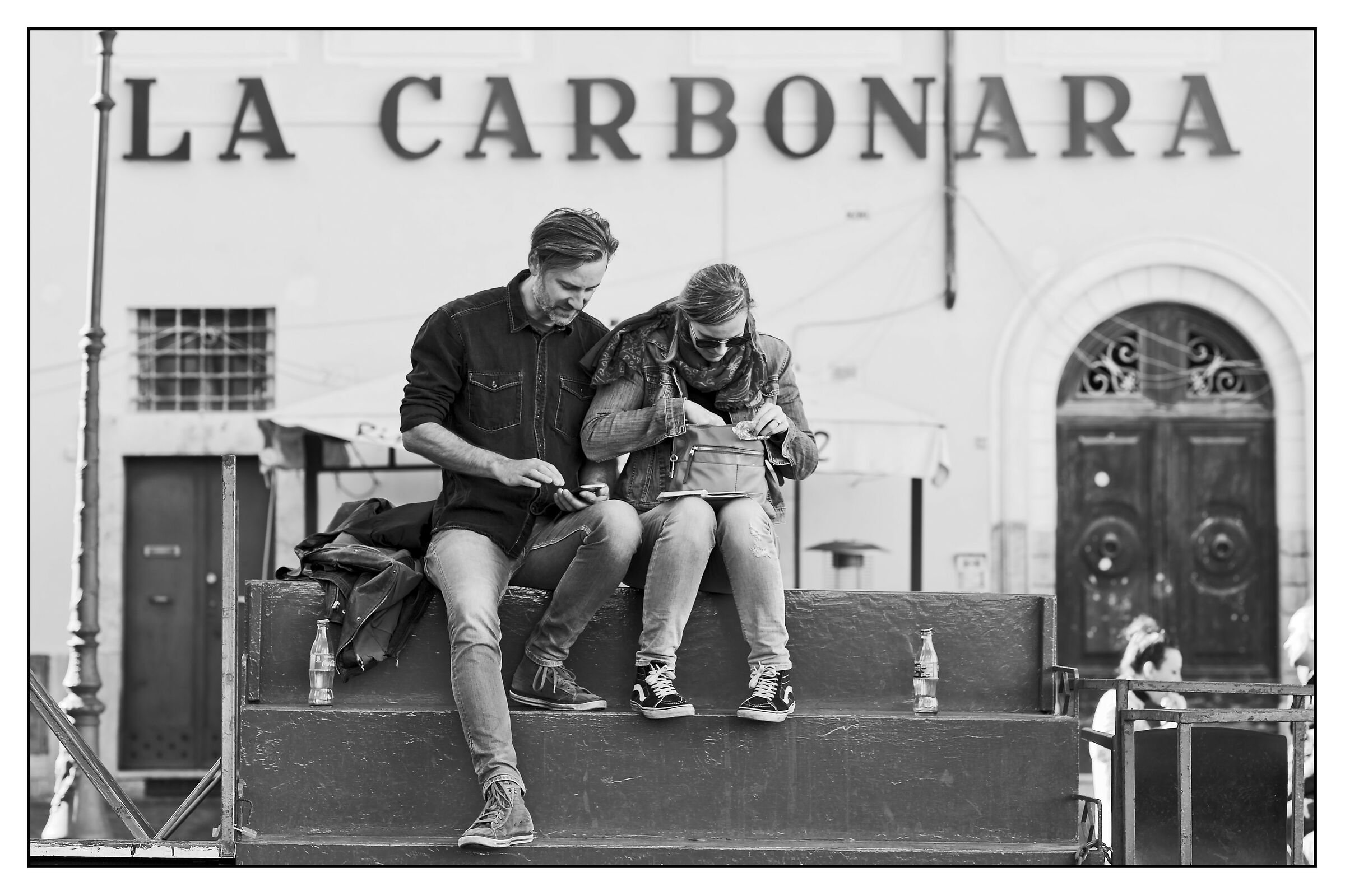 Tourists in the shadow of the largest monument in Rome