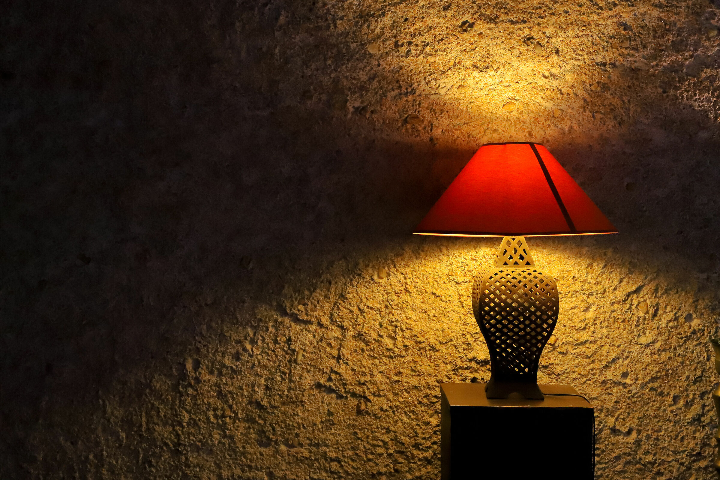 The warm light of the lamp.