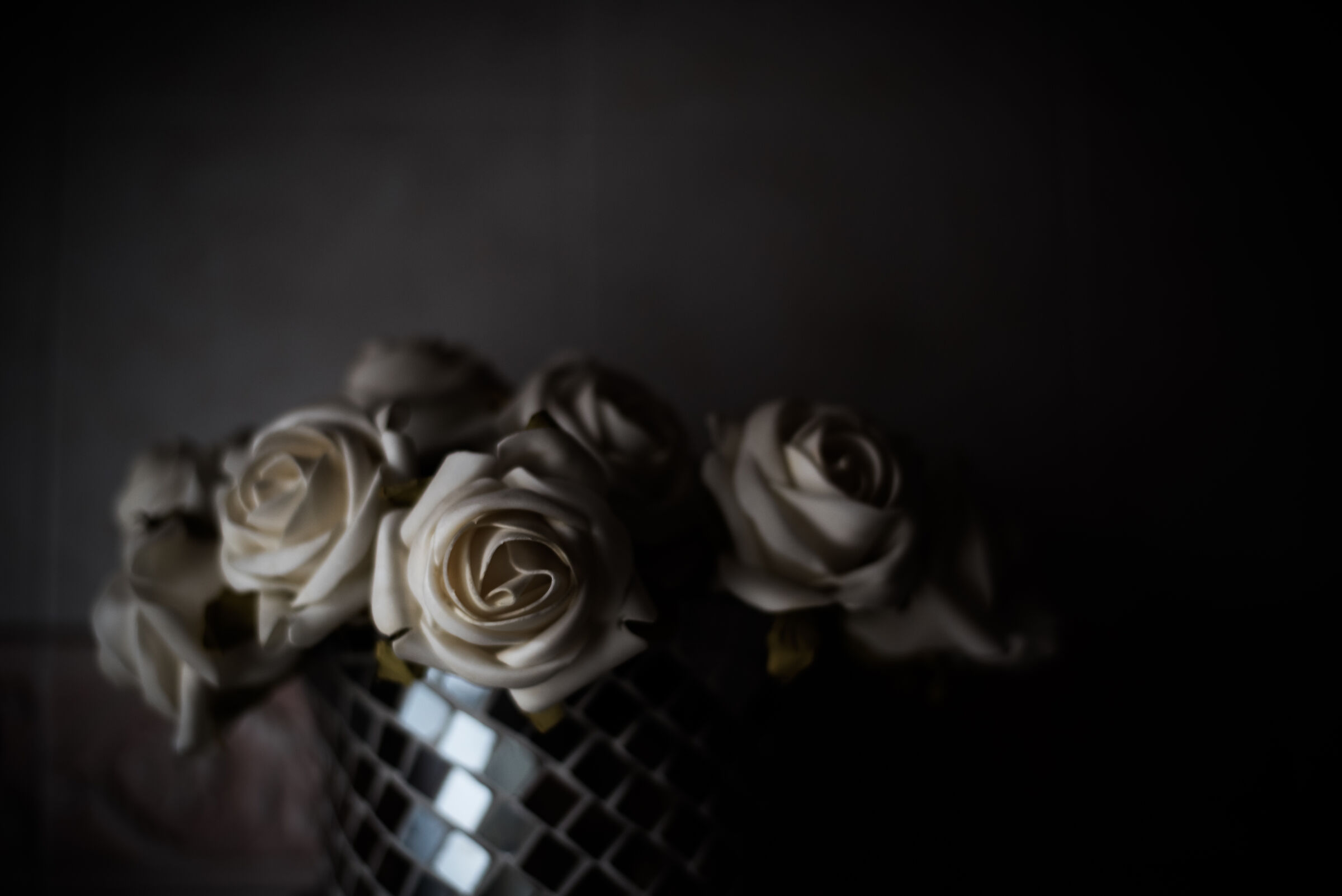 Fake flowers in dim light