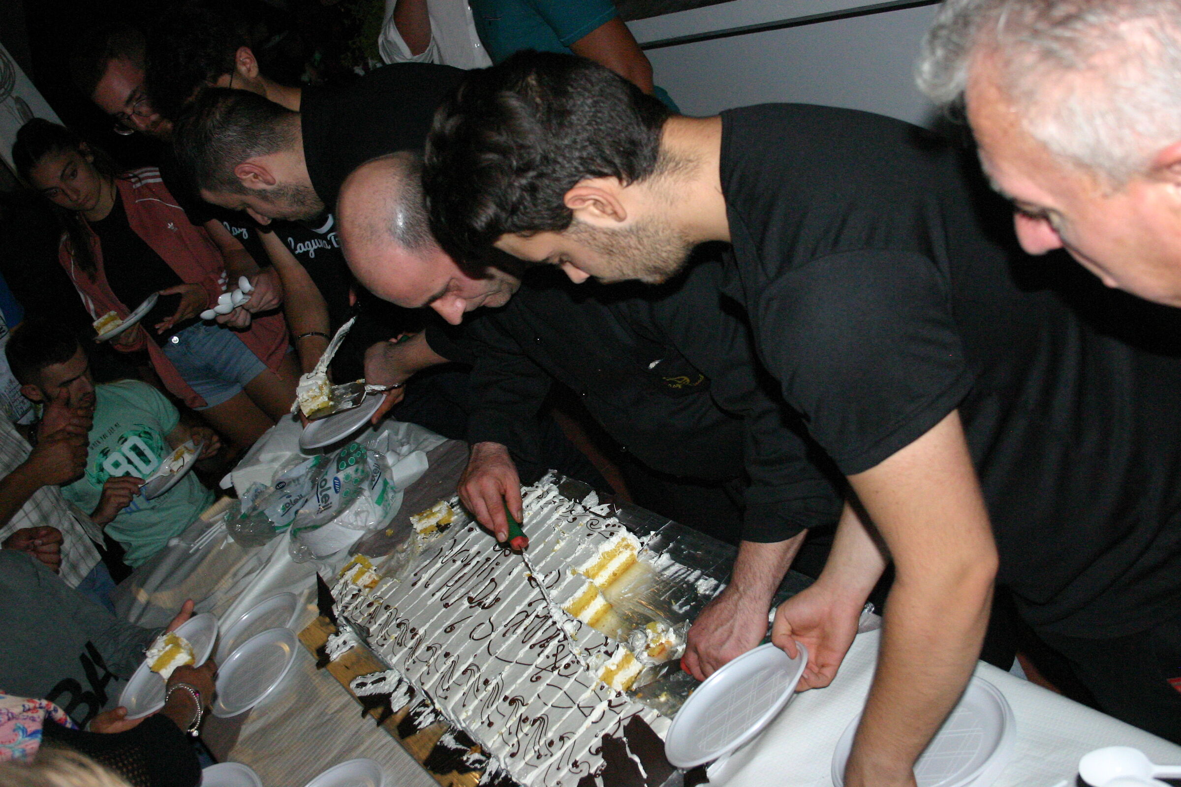 the chef at the cutting of the cake