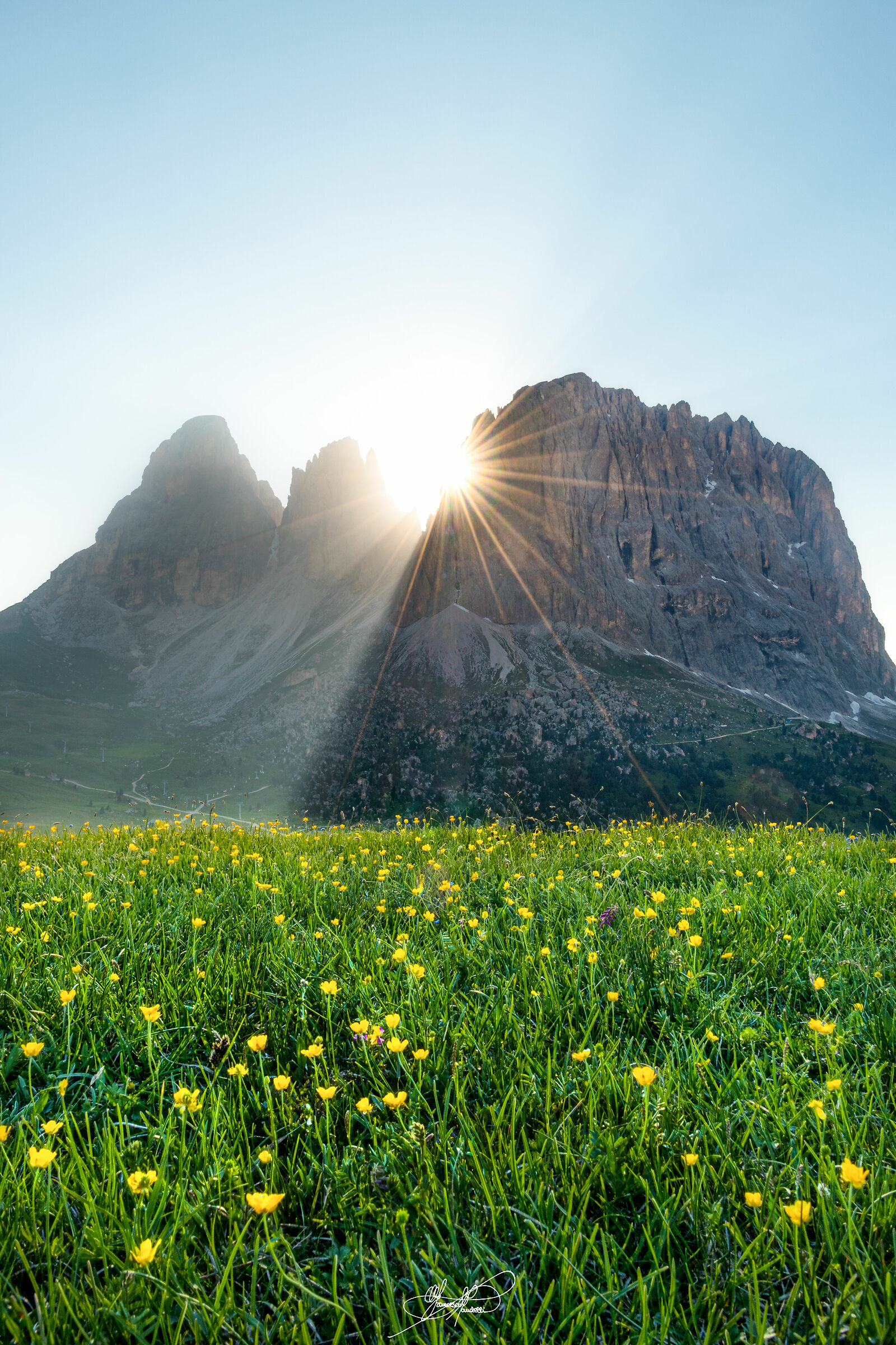 - Rays of sunshine behind the Dolomites -