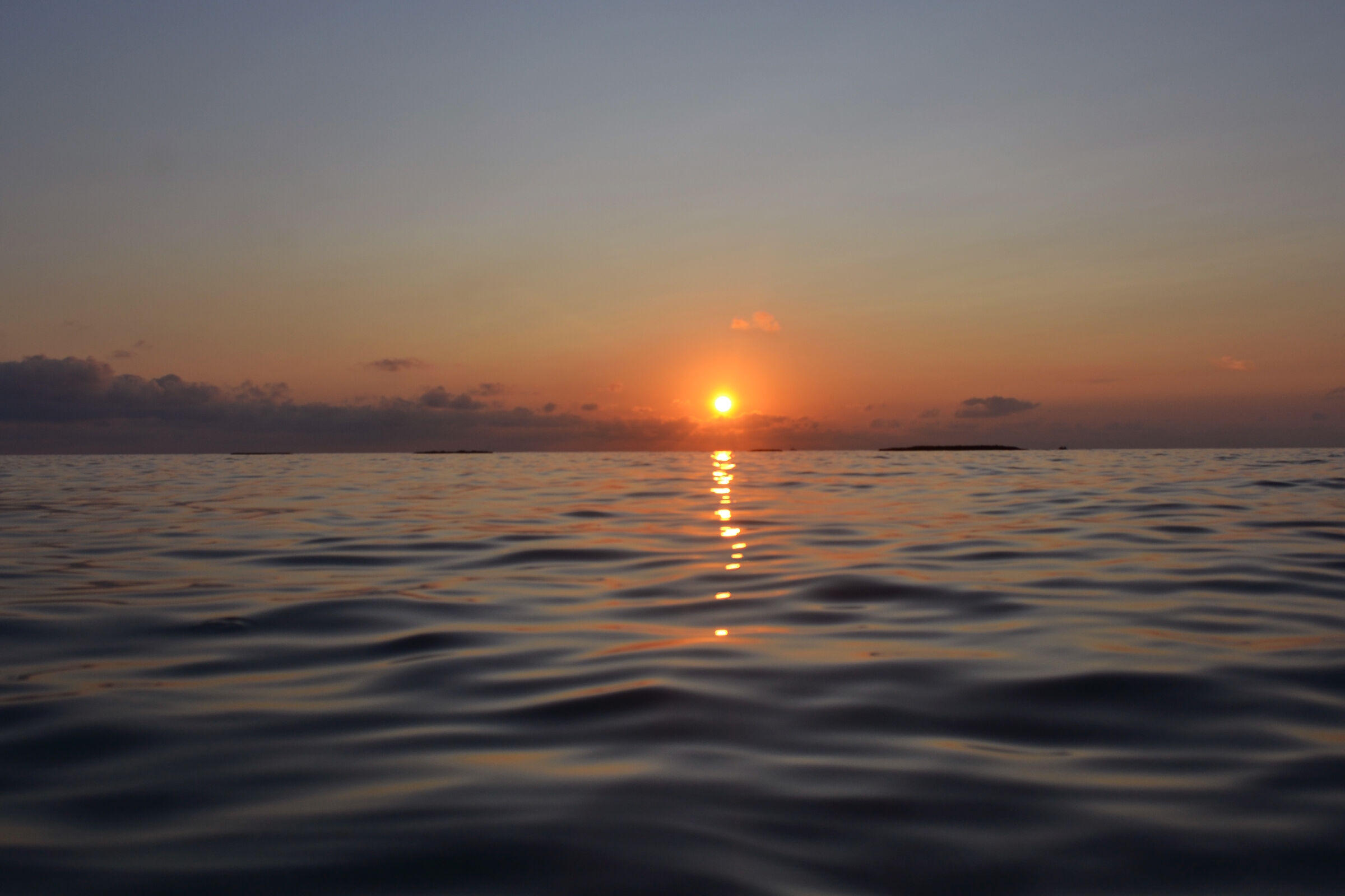 The sun in the waves