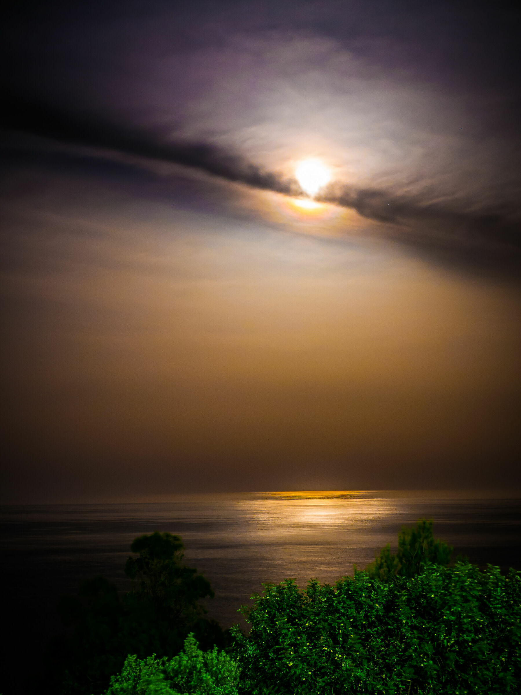 The moon plays hide-and-seek