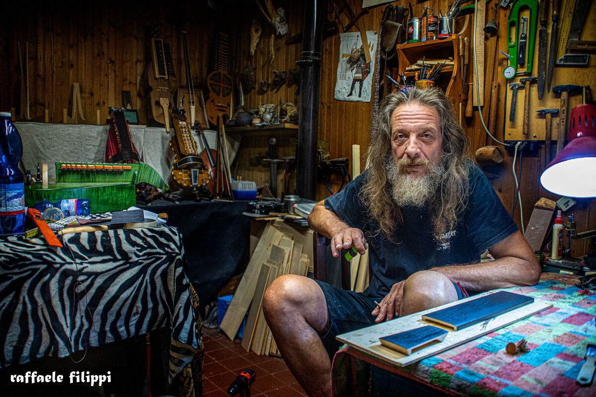 Portrait of Sergio master violin maker, in his workshop