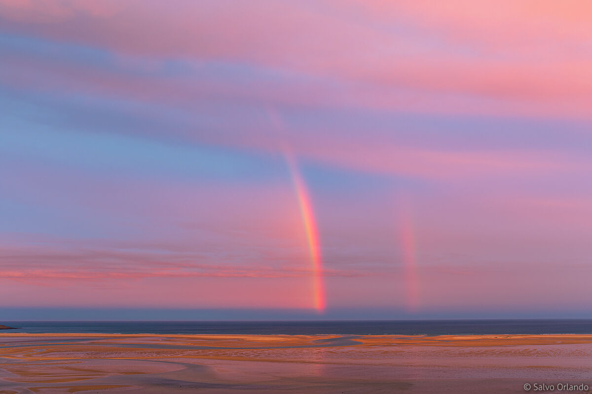 Rainbow, red beach and infinite shades of color