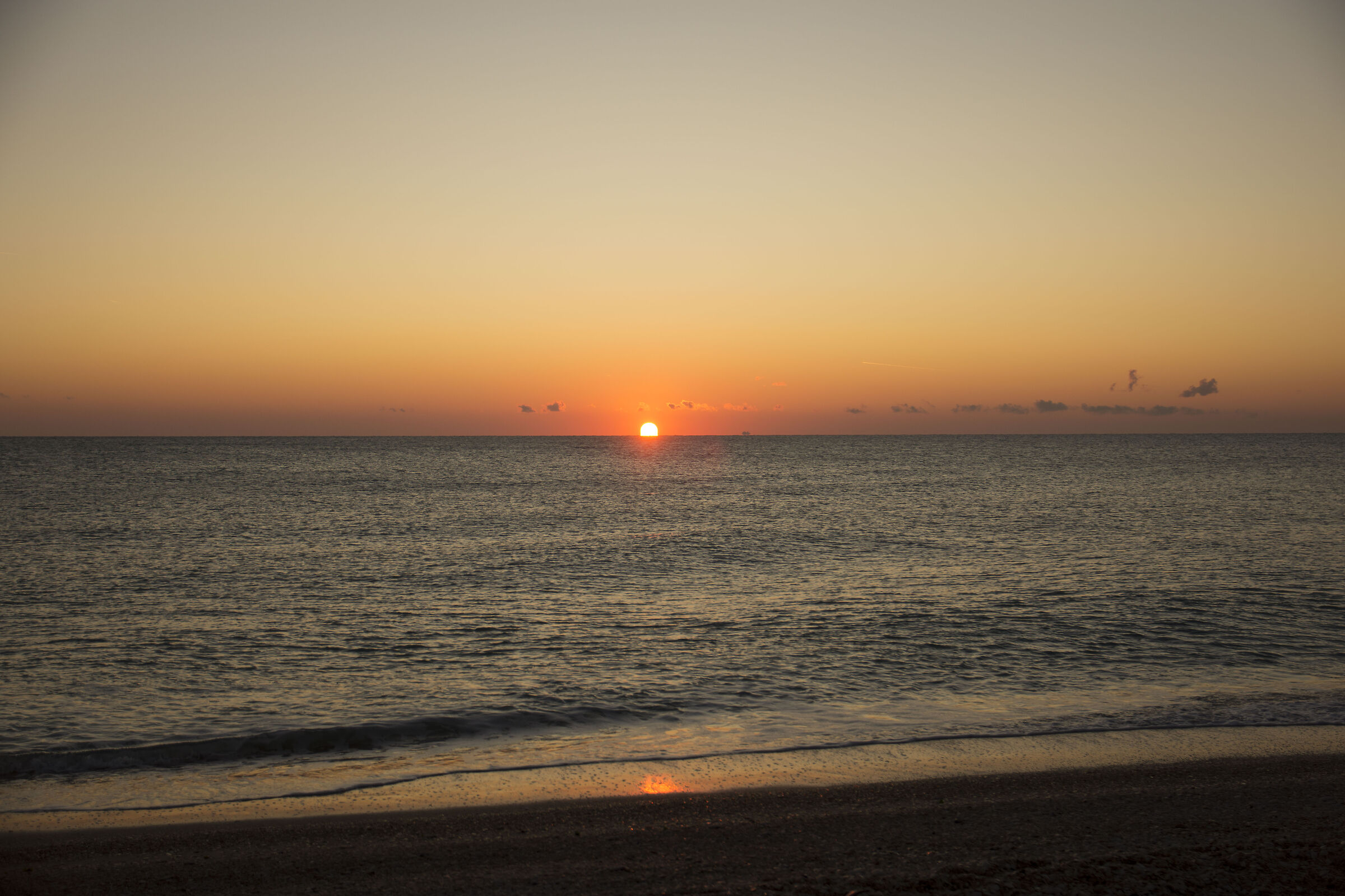 the sea holds the colors of the new day at baptism