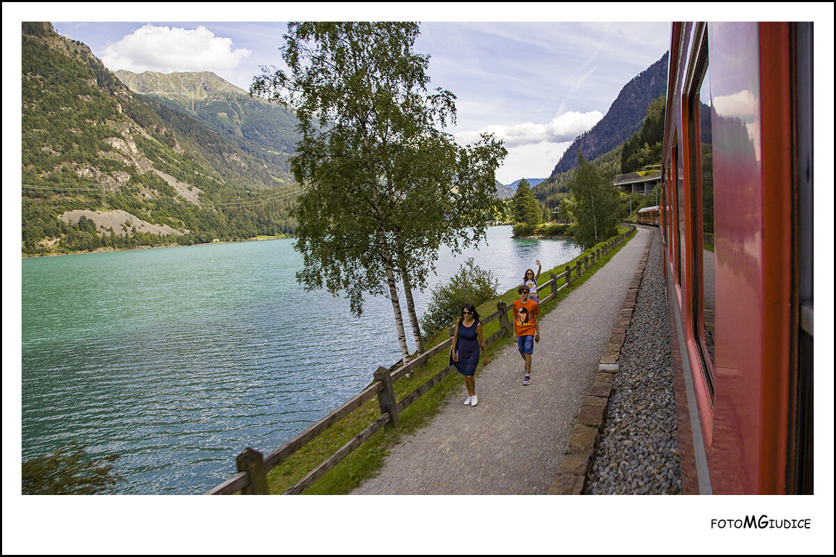 Bernina's red train on Lake Poschiavo