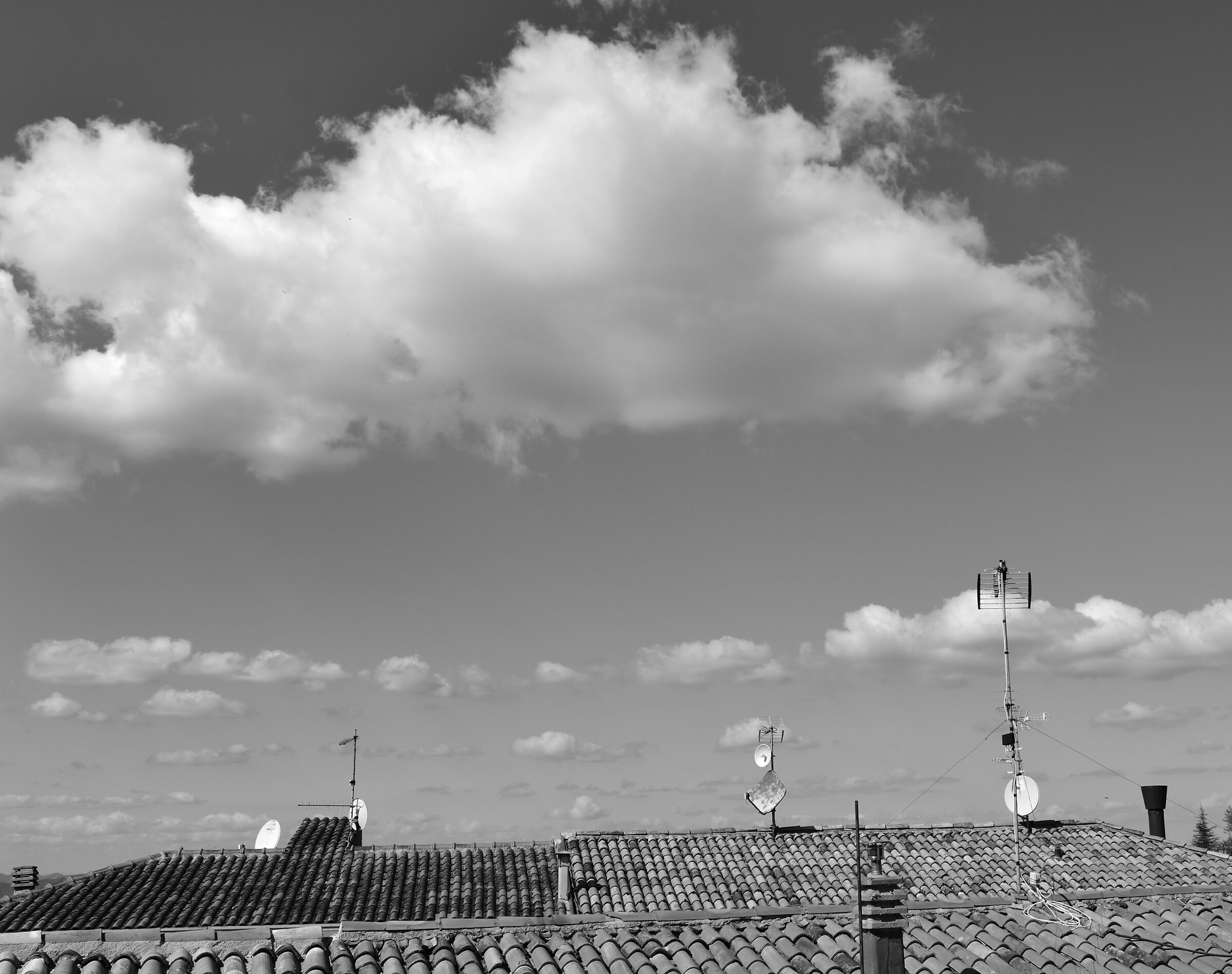 between roofs and clouds