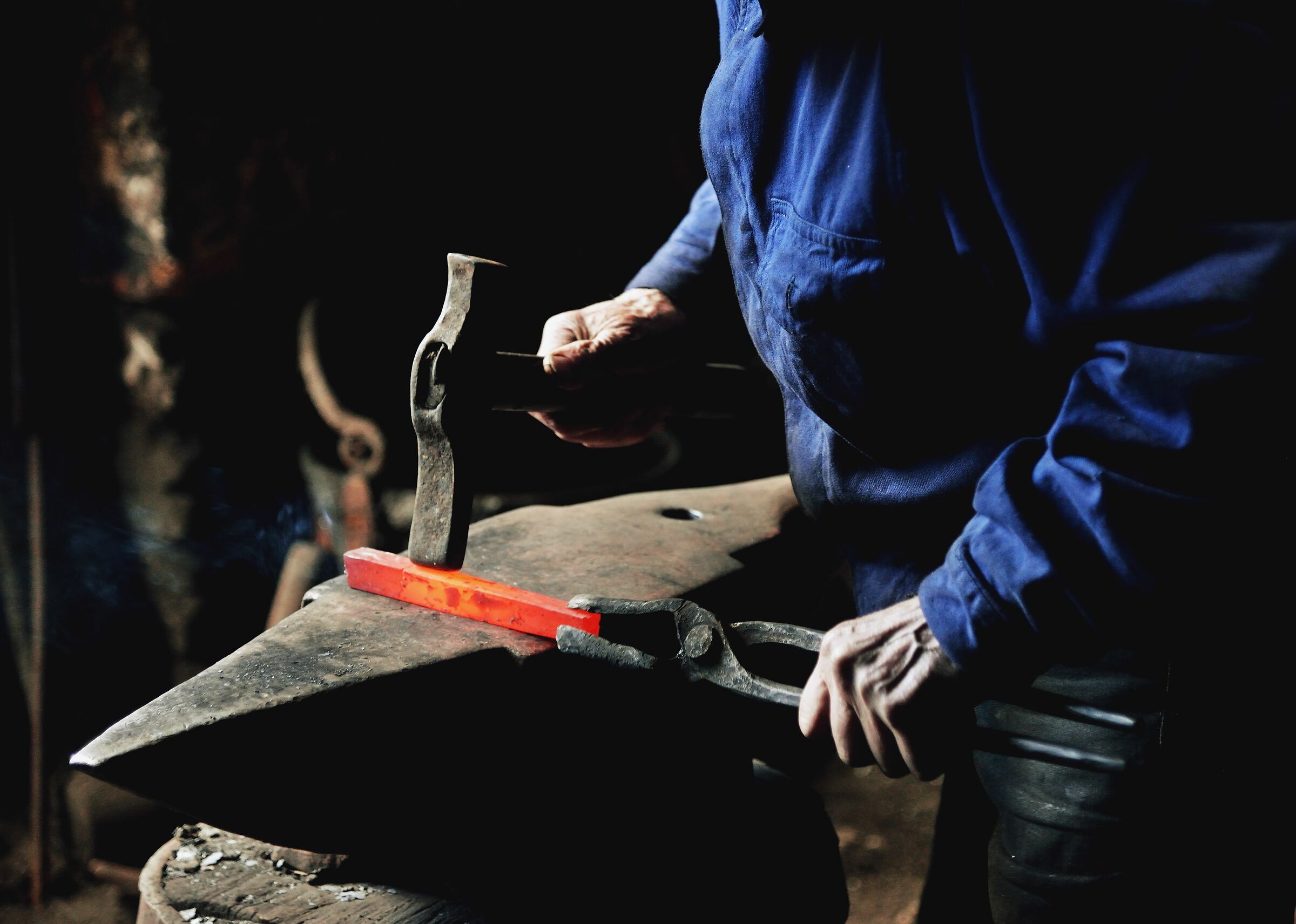 between anvil and hammer