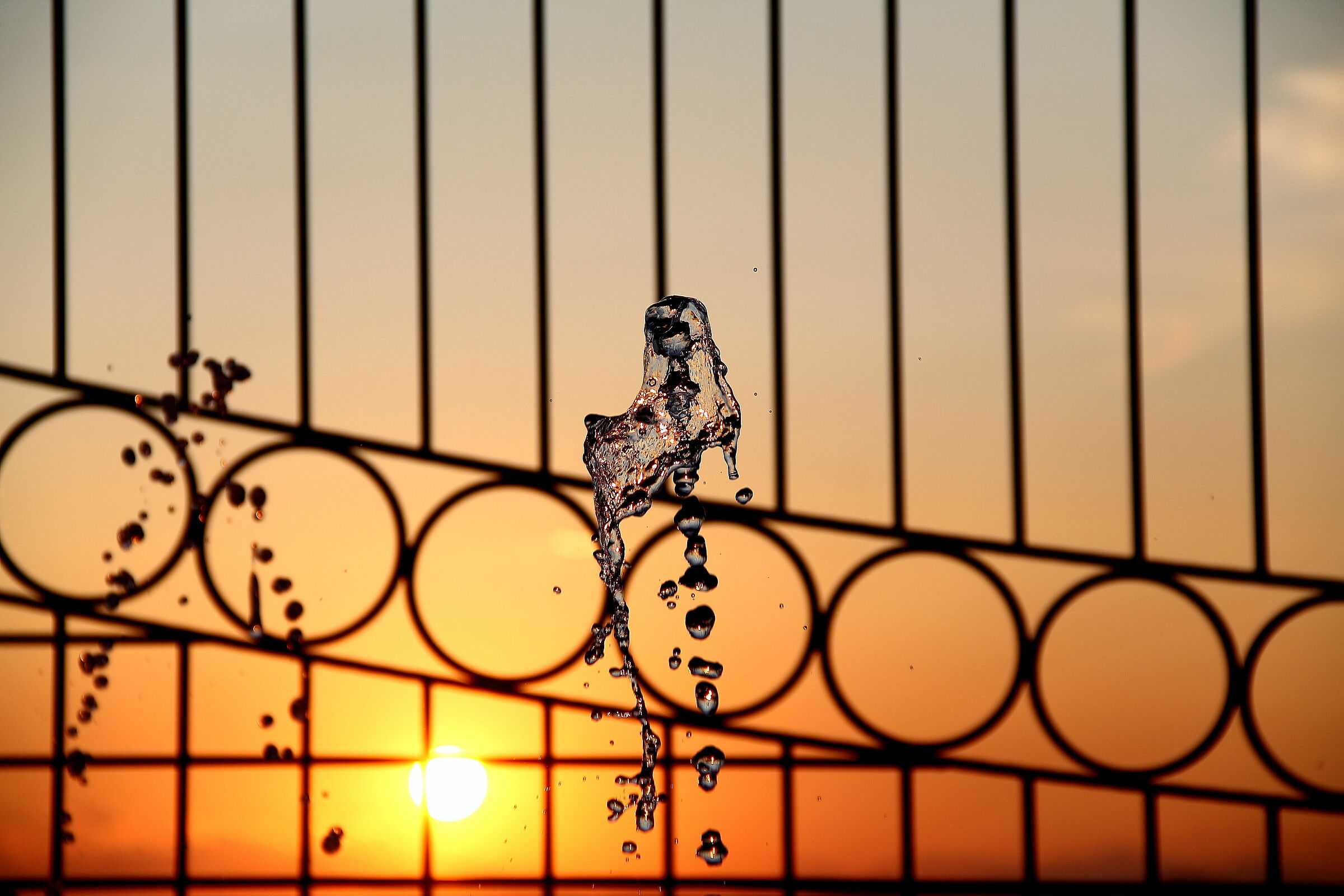 Water molecules in an August sunset