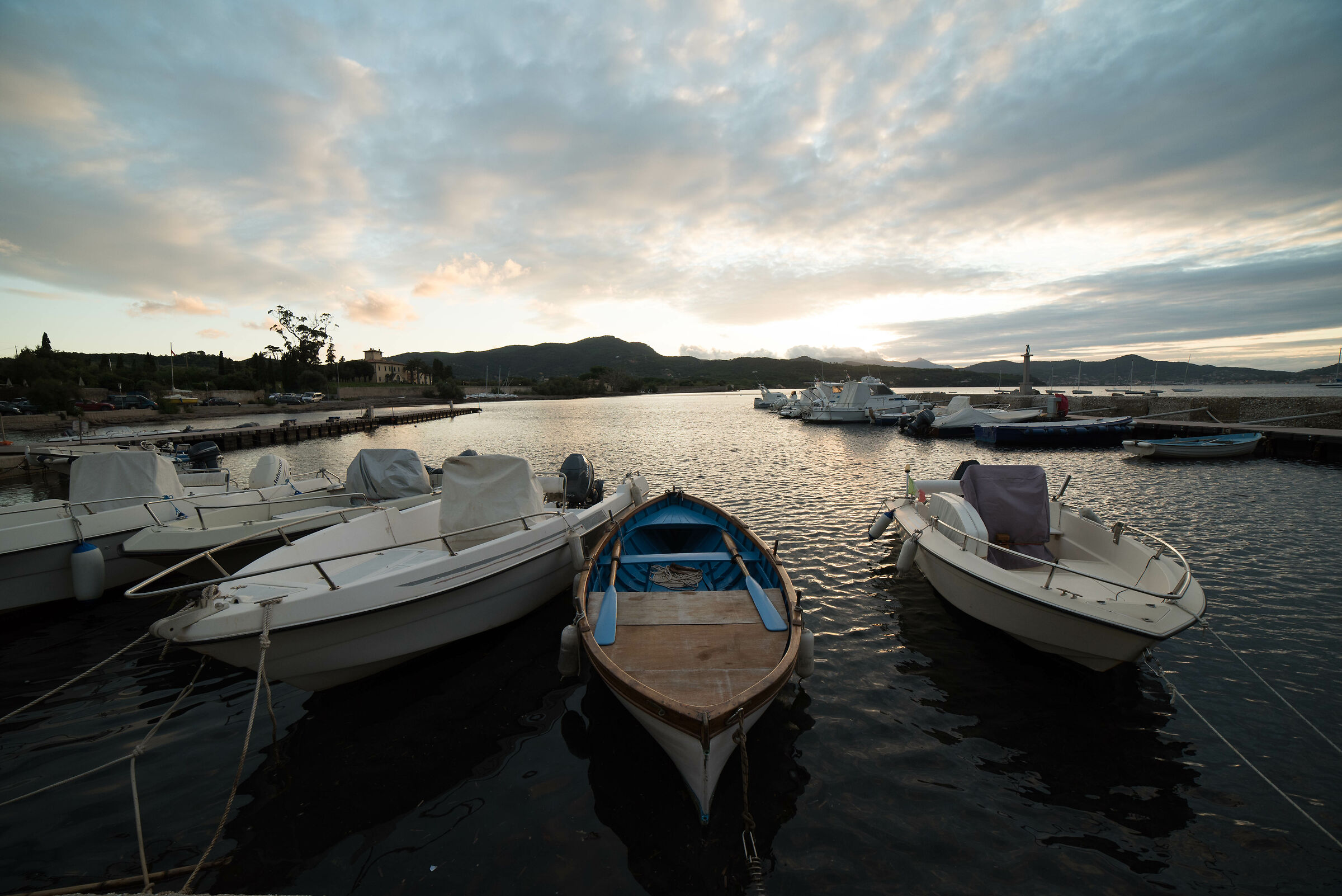 Boats moored at sunset