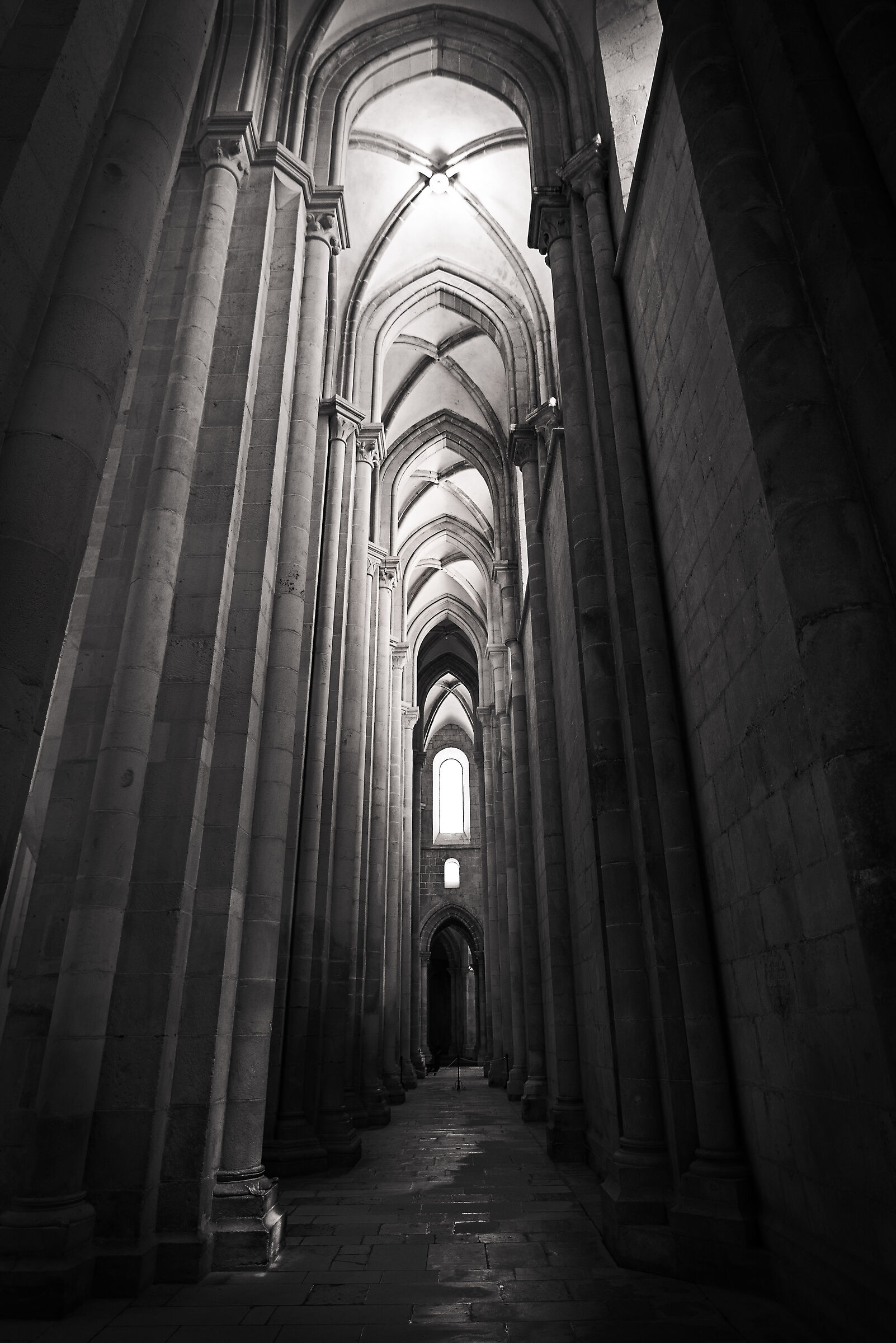 The narrow, dark aisle