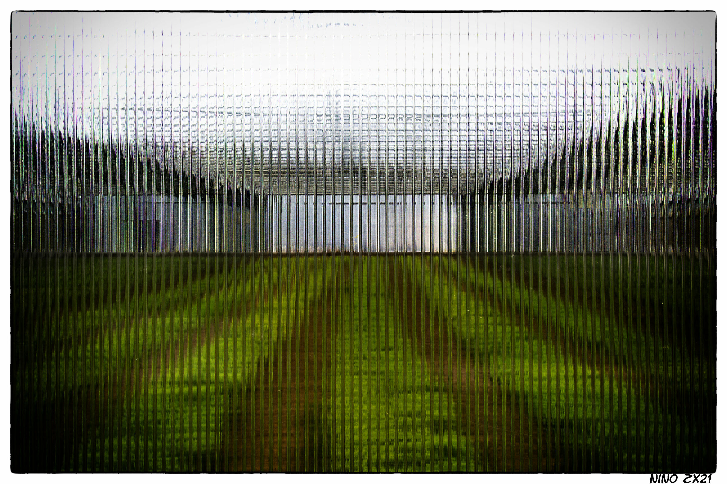 Cross.... glass window of a greenhouse.
