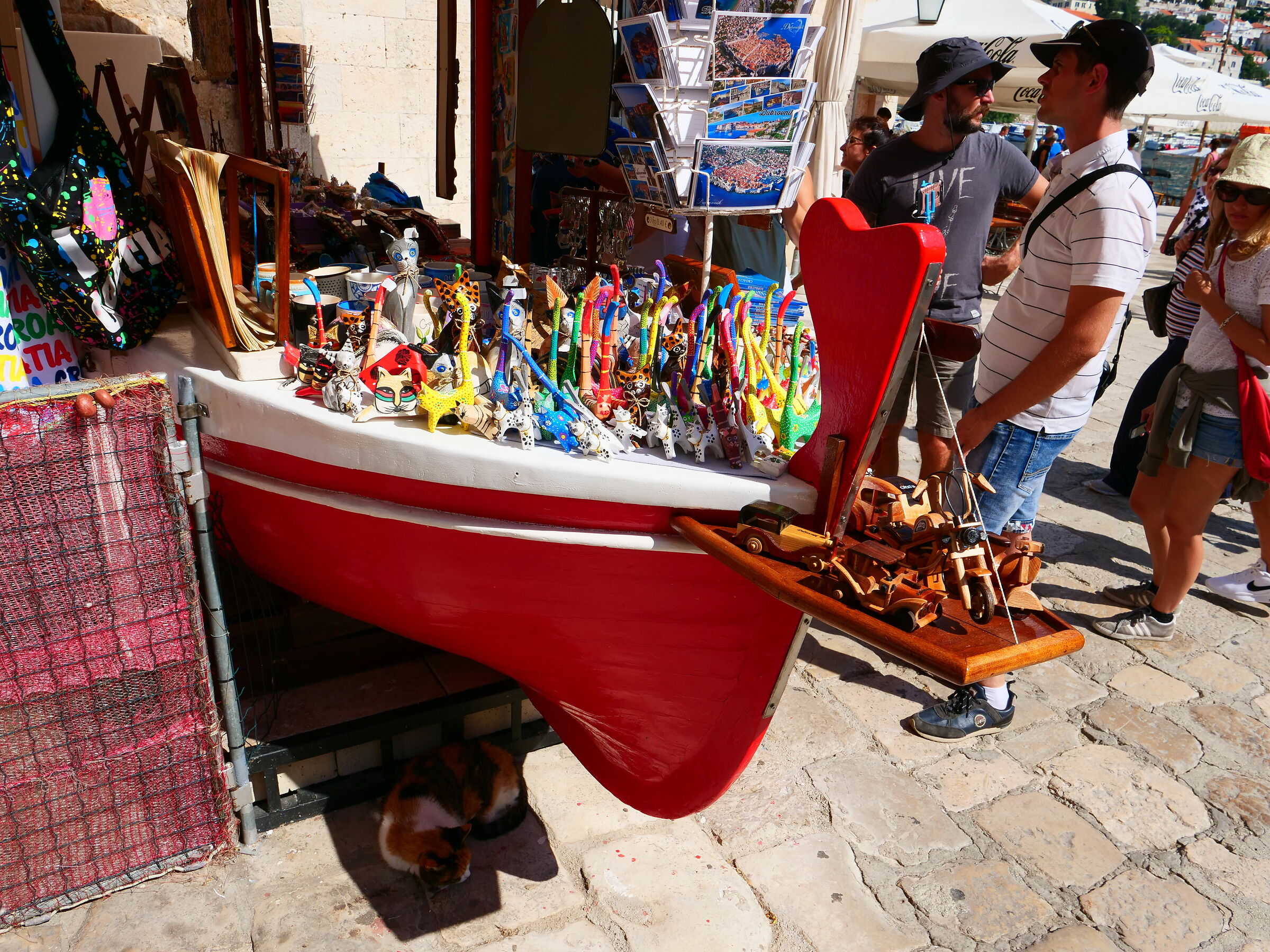 Wooden cats and real cat