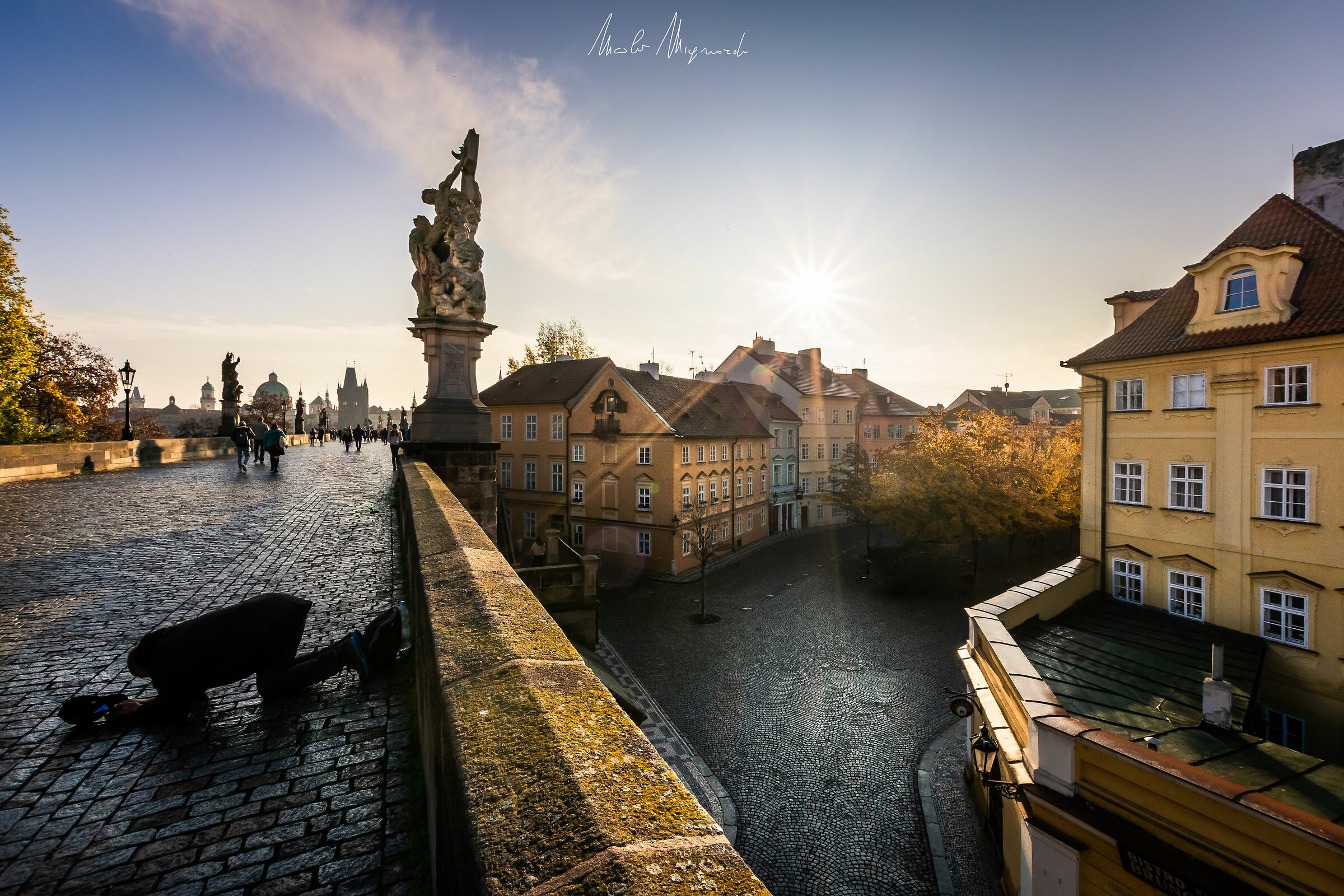 The morning of the beggar on Charles Bridge