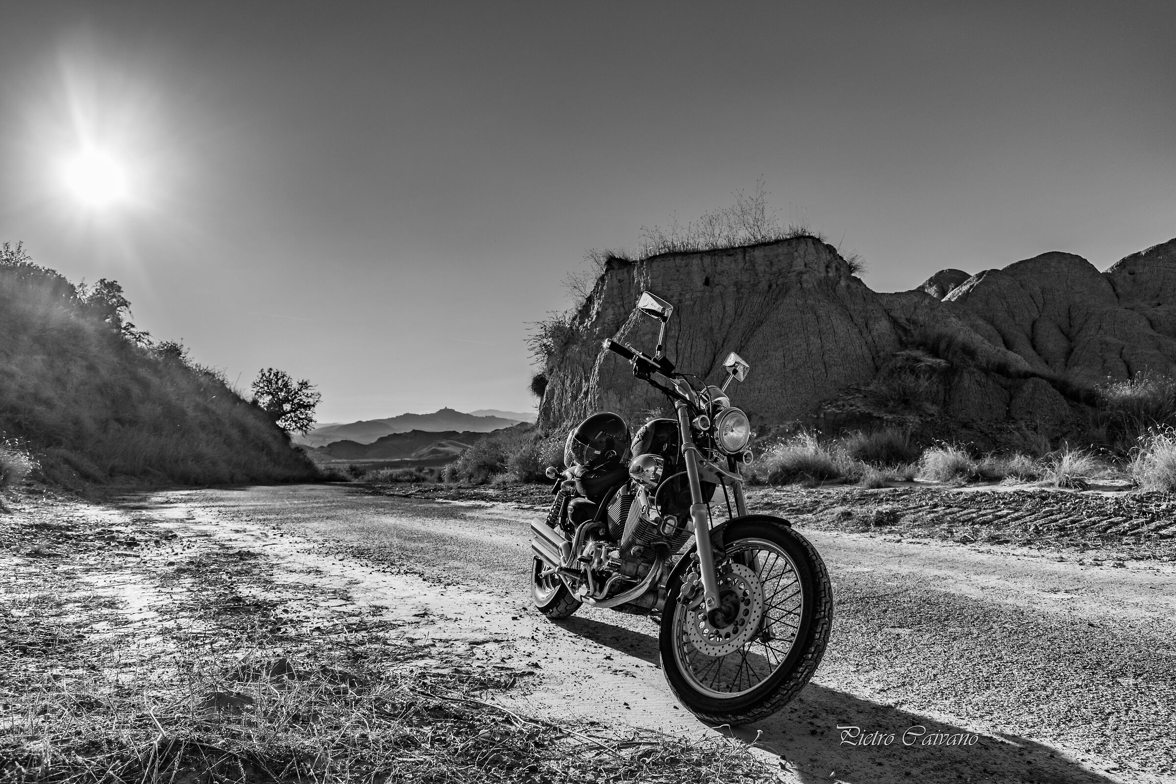 Riding a motorbike among the Calanchi