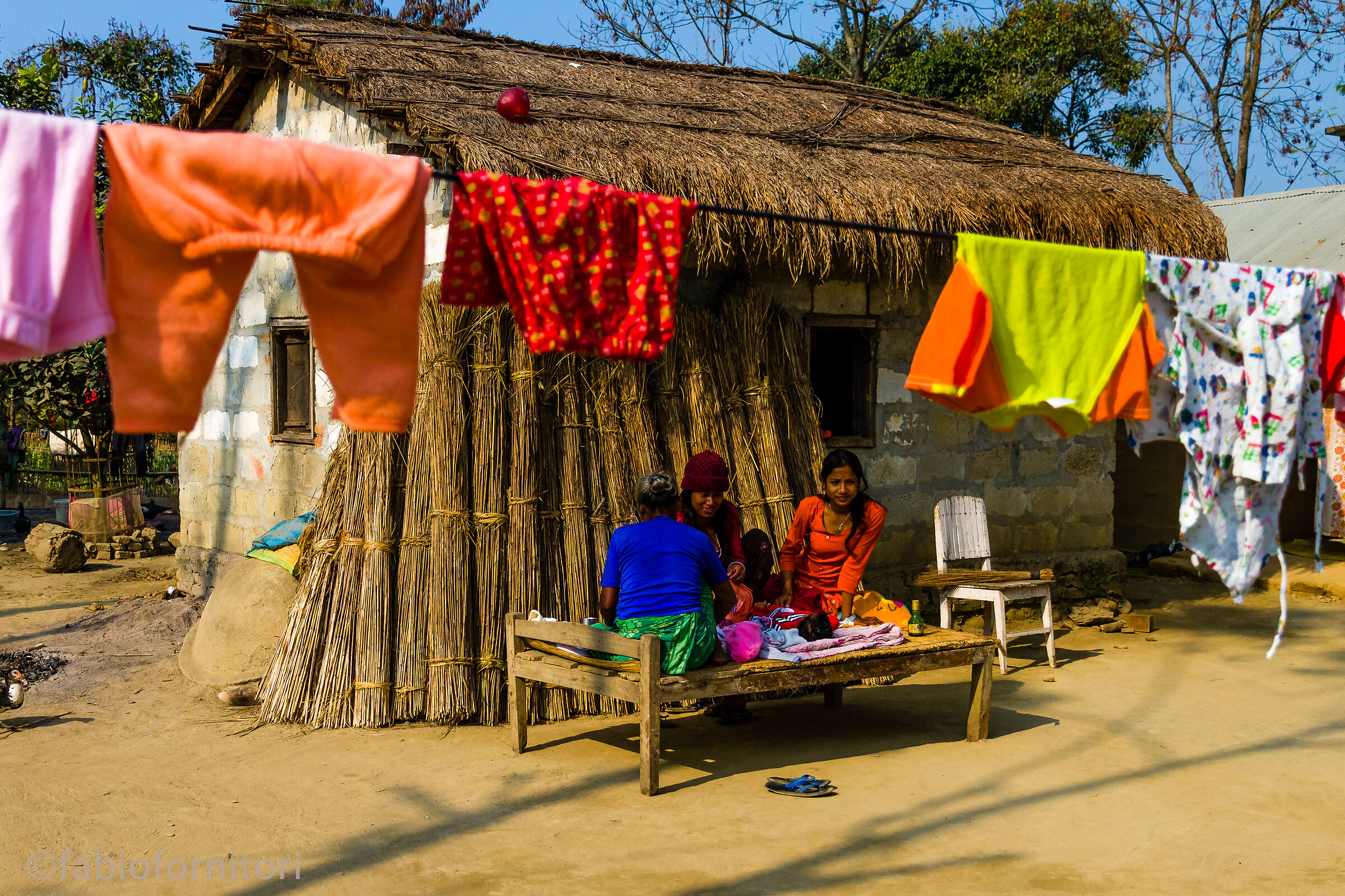 Sauraha , Women outside the house  , Nepal 2010