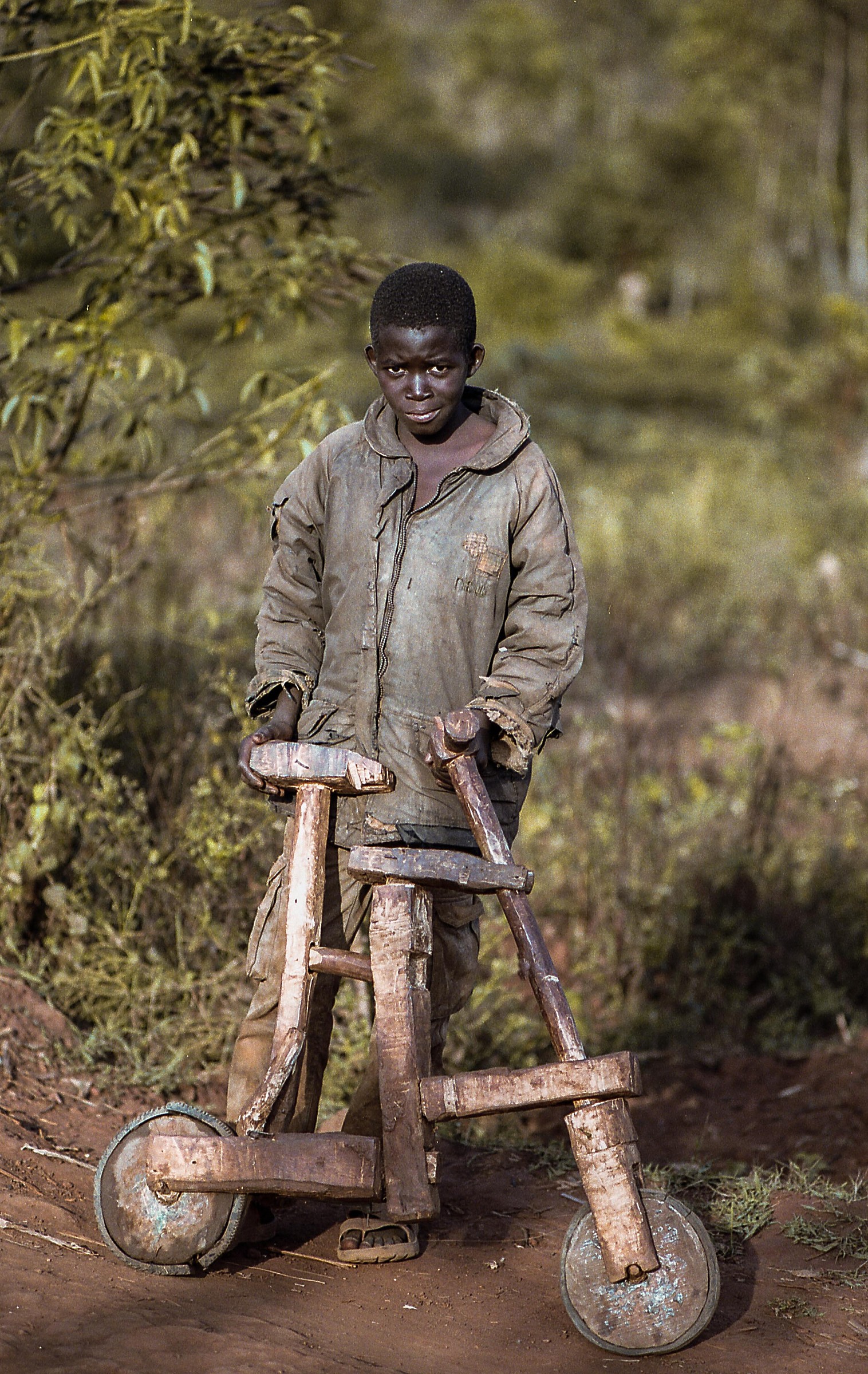 Barundi boy with the typical bicycle wood