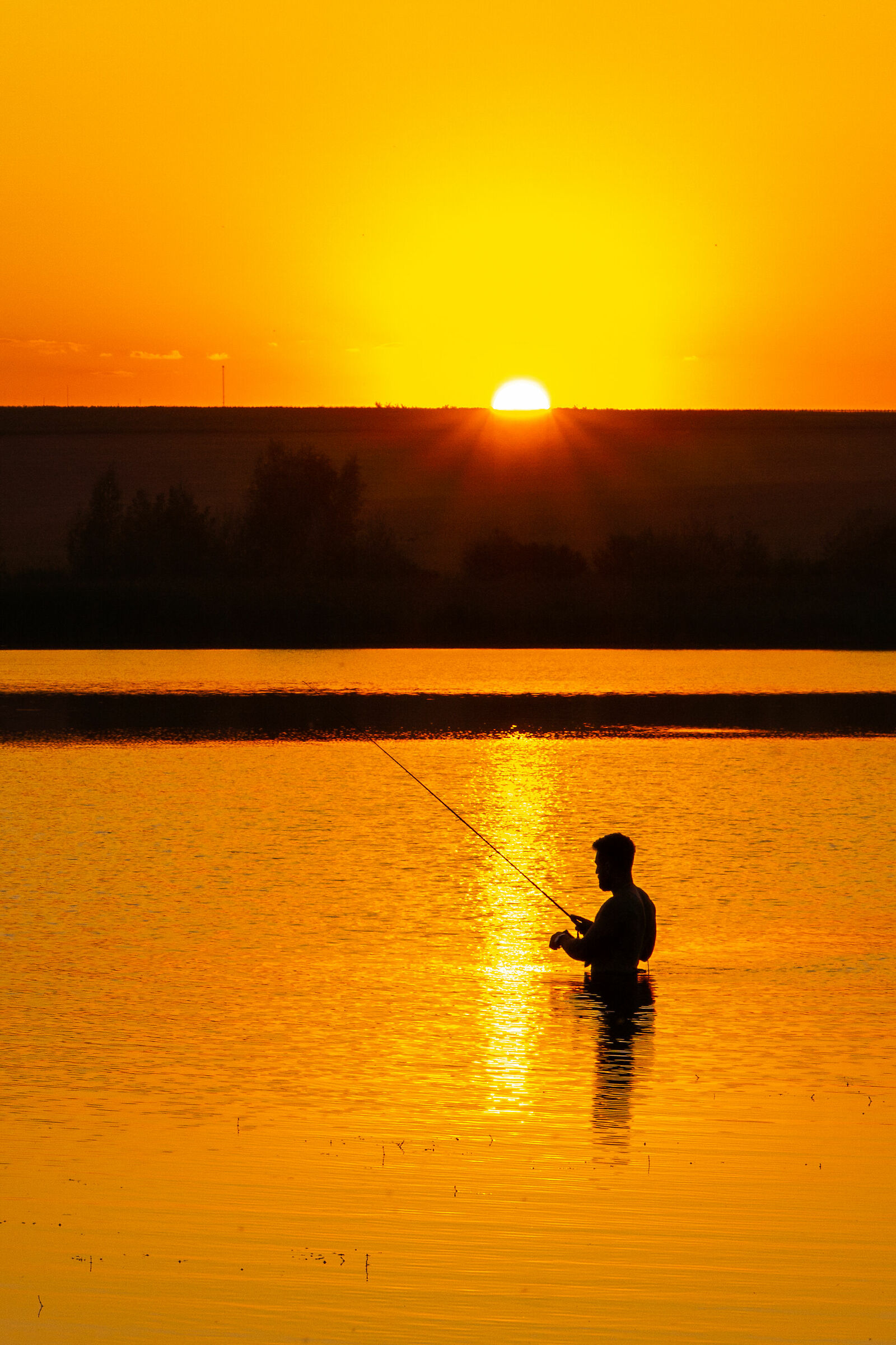 Sunset fishing on lake