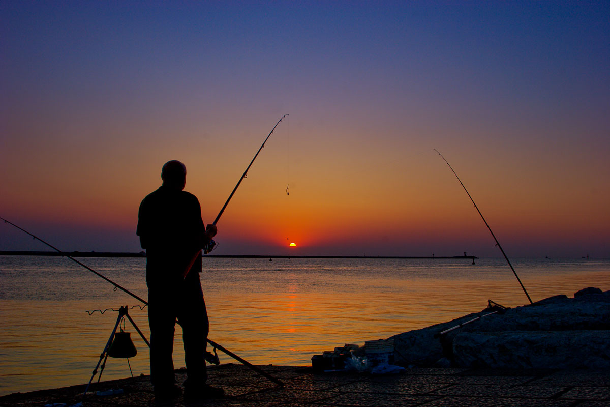 Fisherman in dam