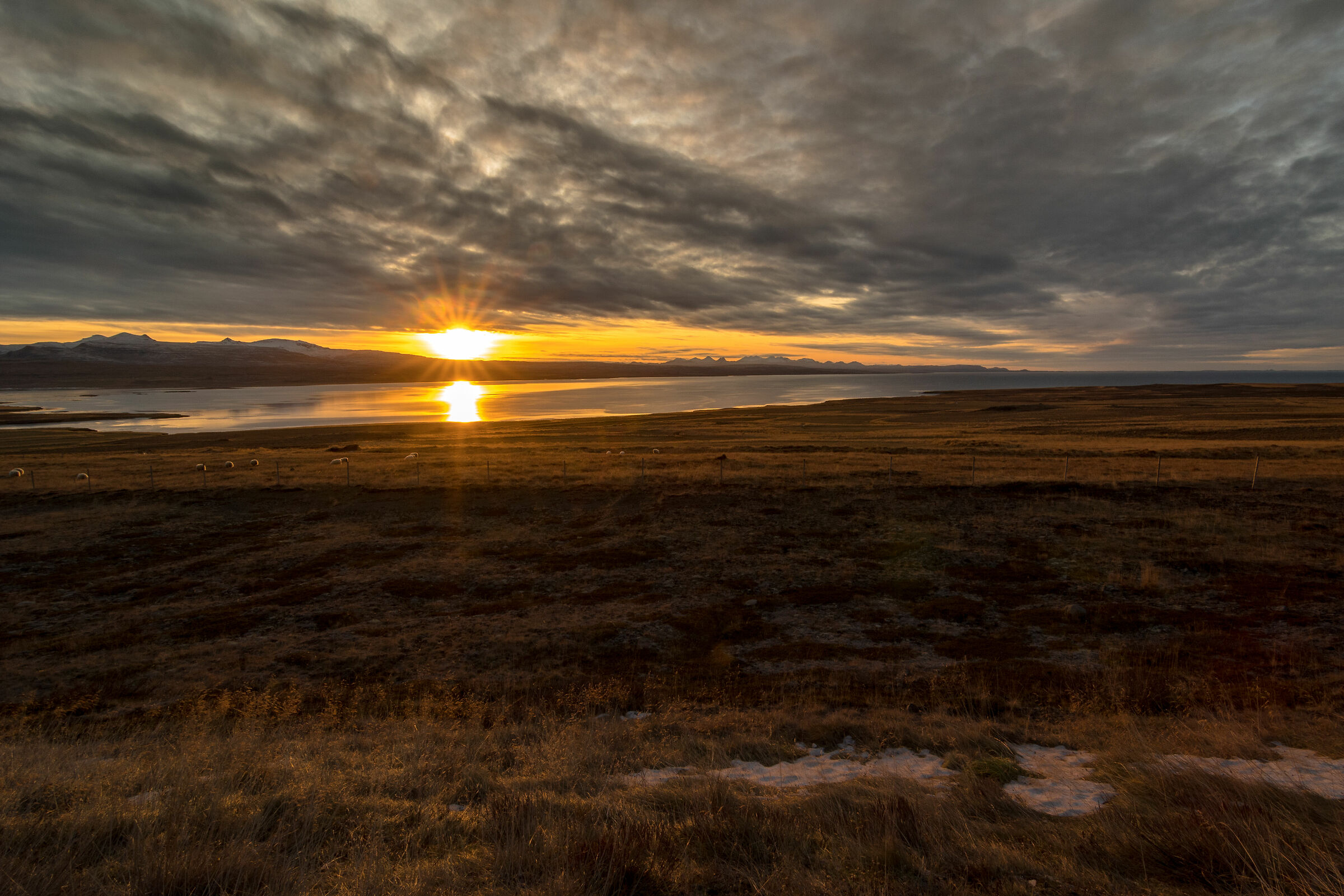 Sunset over the fjords of the West