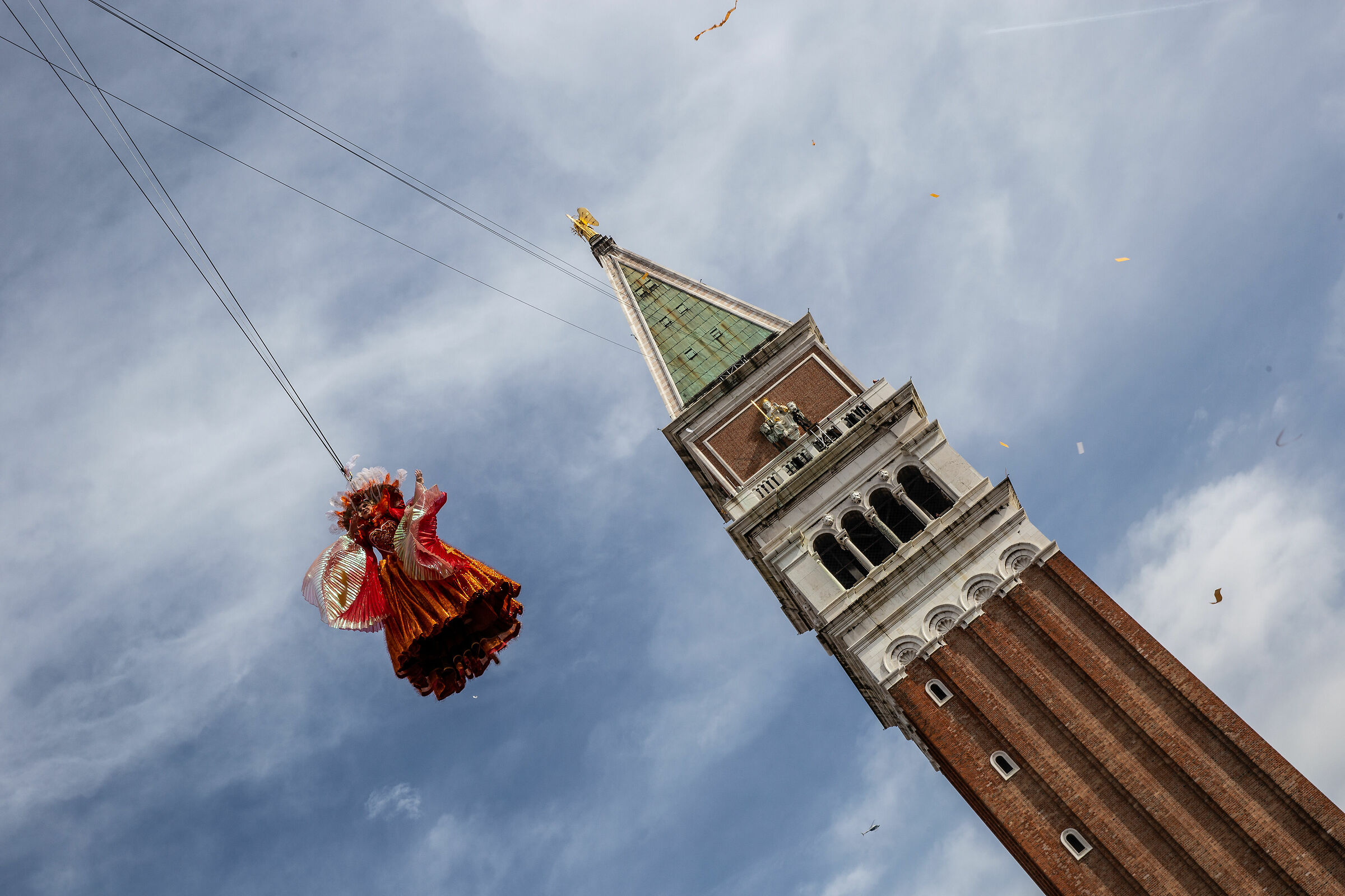 The flight of an angel and carnival comes on