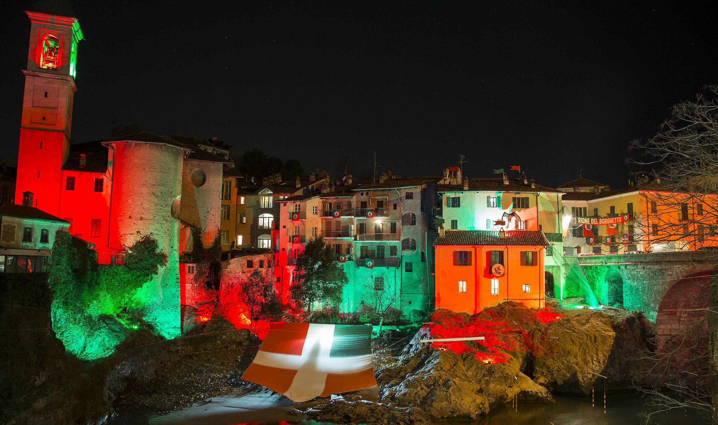 The Old Bridge of Ivrea with the colors of the carnival
