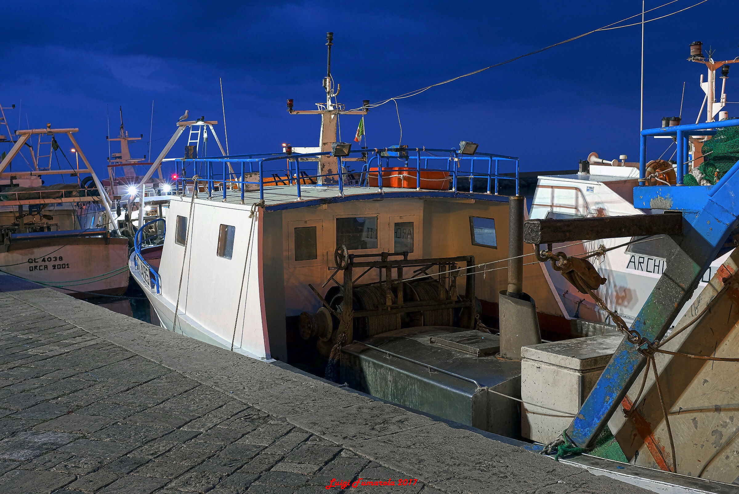 I'm a fishing boat at night.