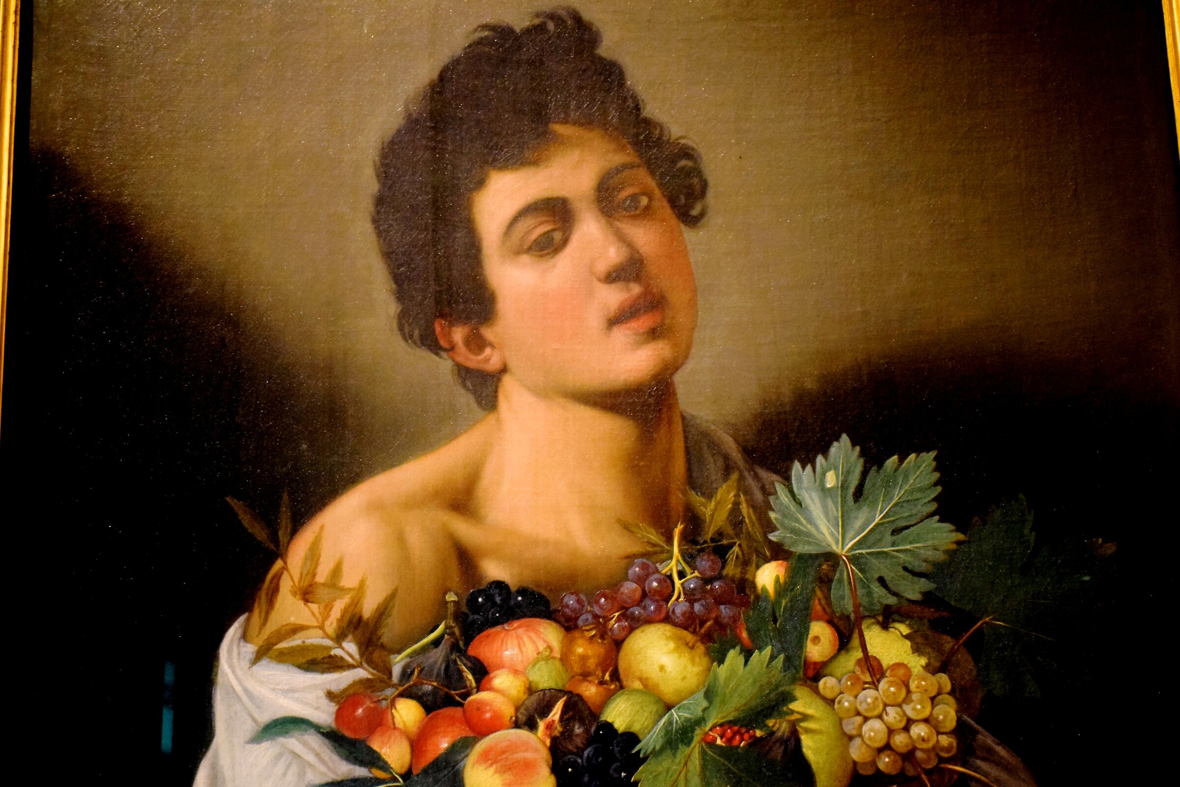 Caravaggio "Giovane con canestro di frutta"