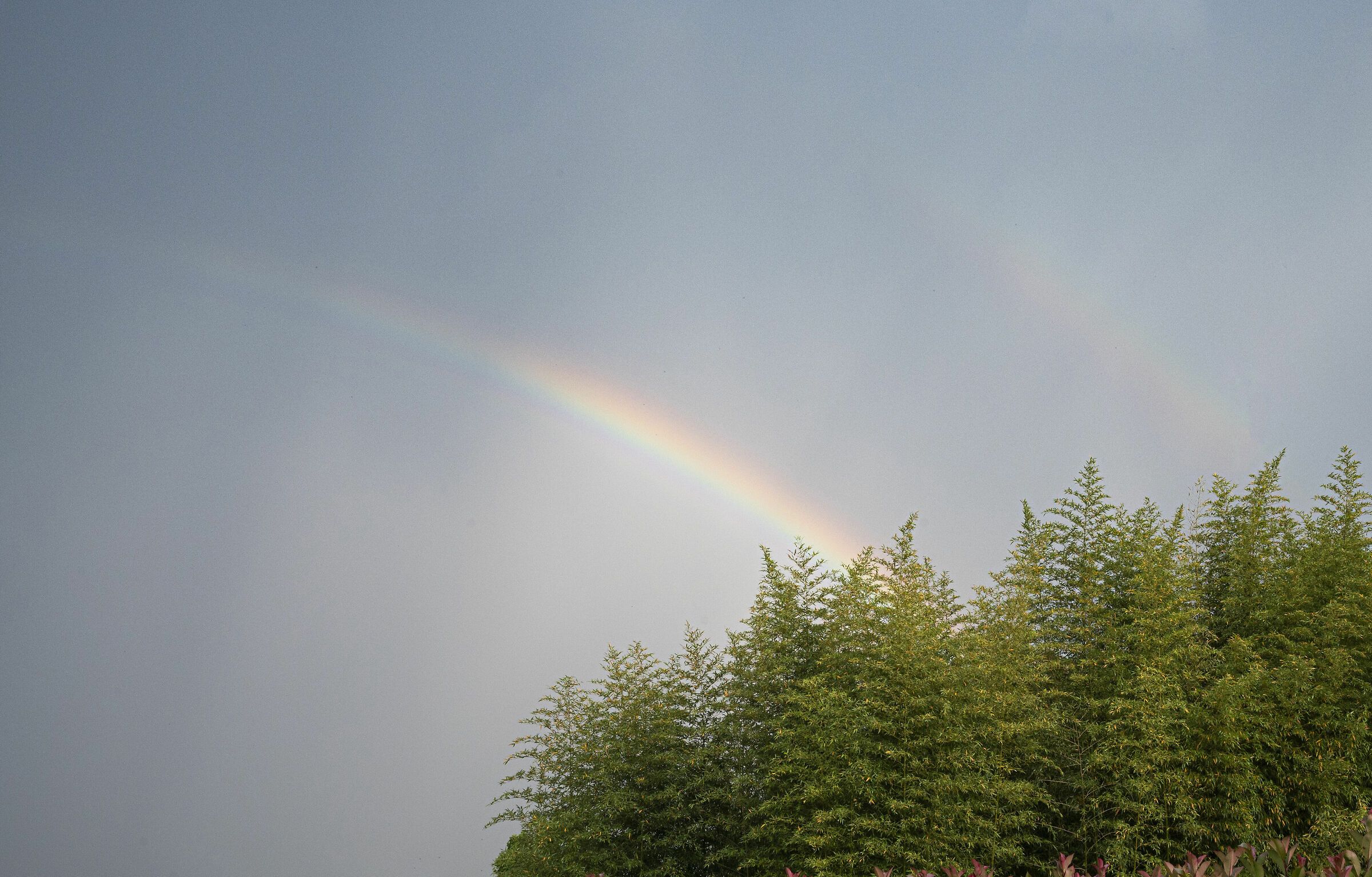hail seen from afar with rainbow