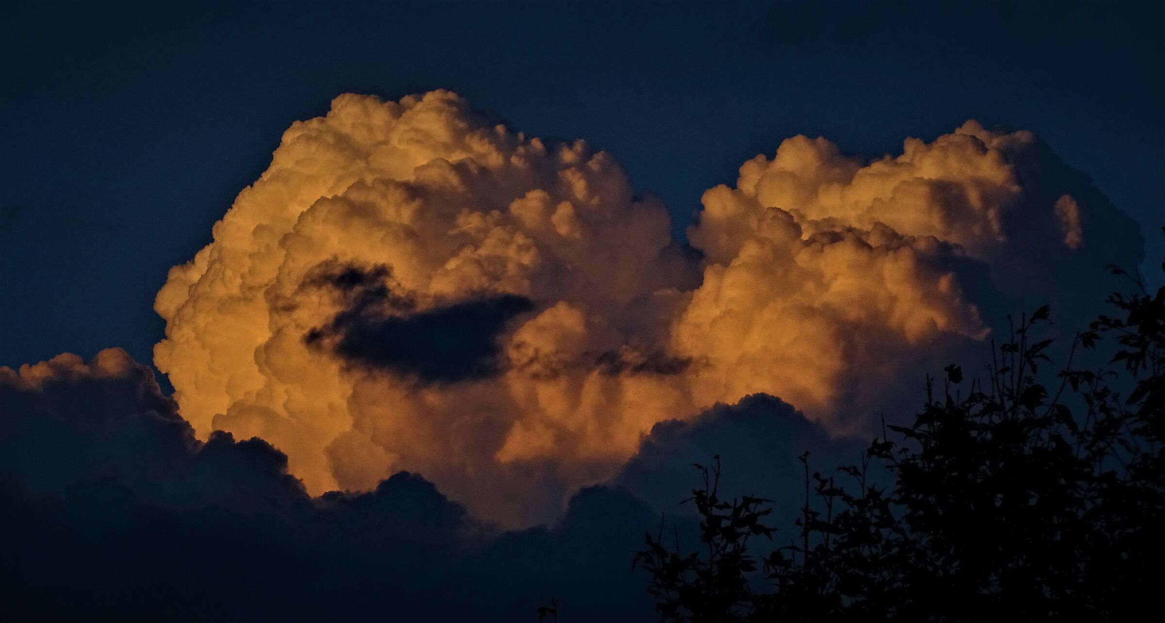 menacing cloud at the setting of the sun.