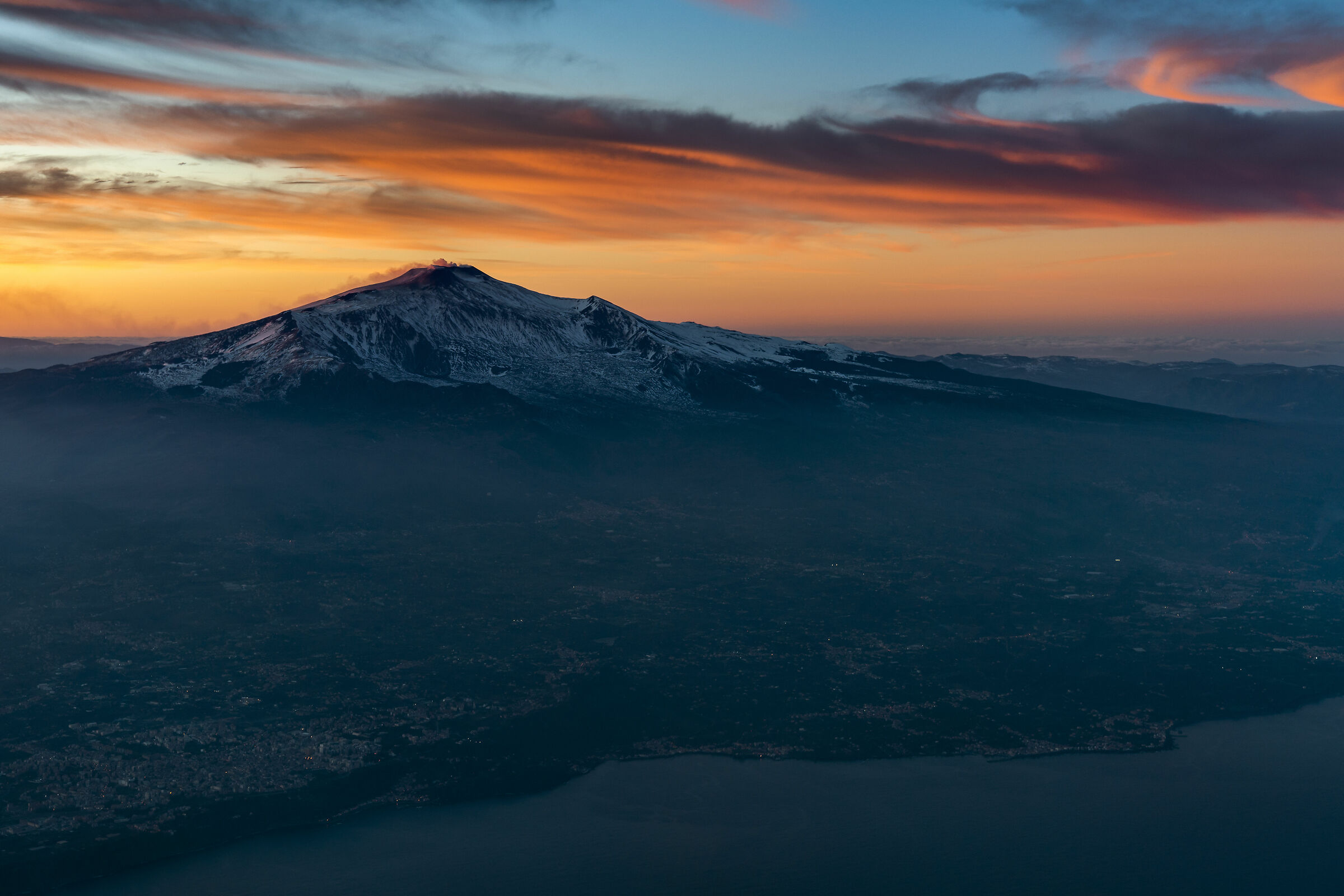 Snowy Mount Etna taking off from Catania