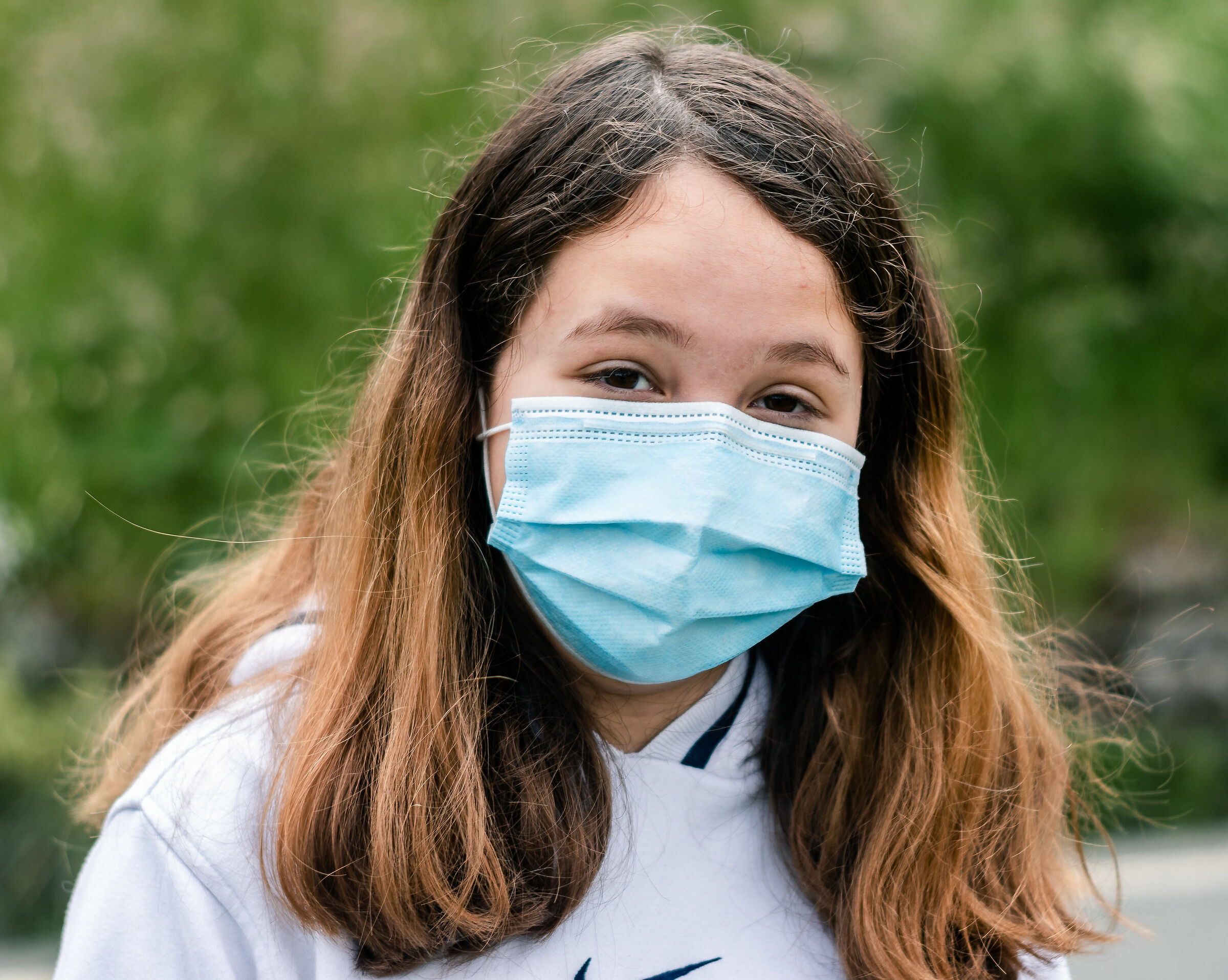 Portrait of a little girl with a mask