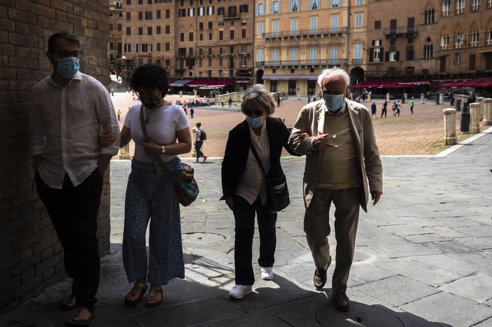Family walking. Piazza di Campo, Siena
