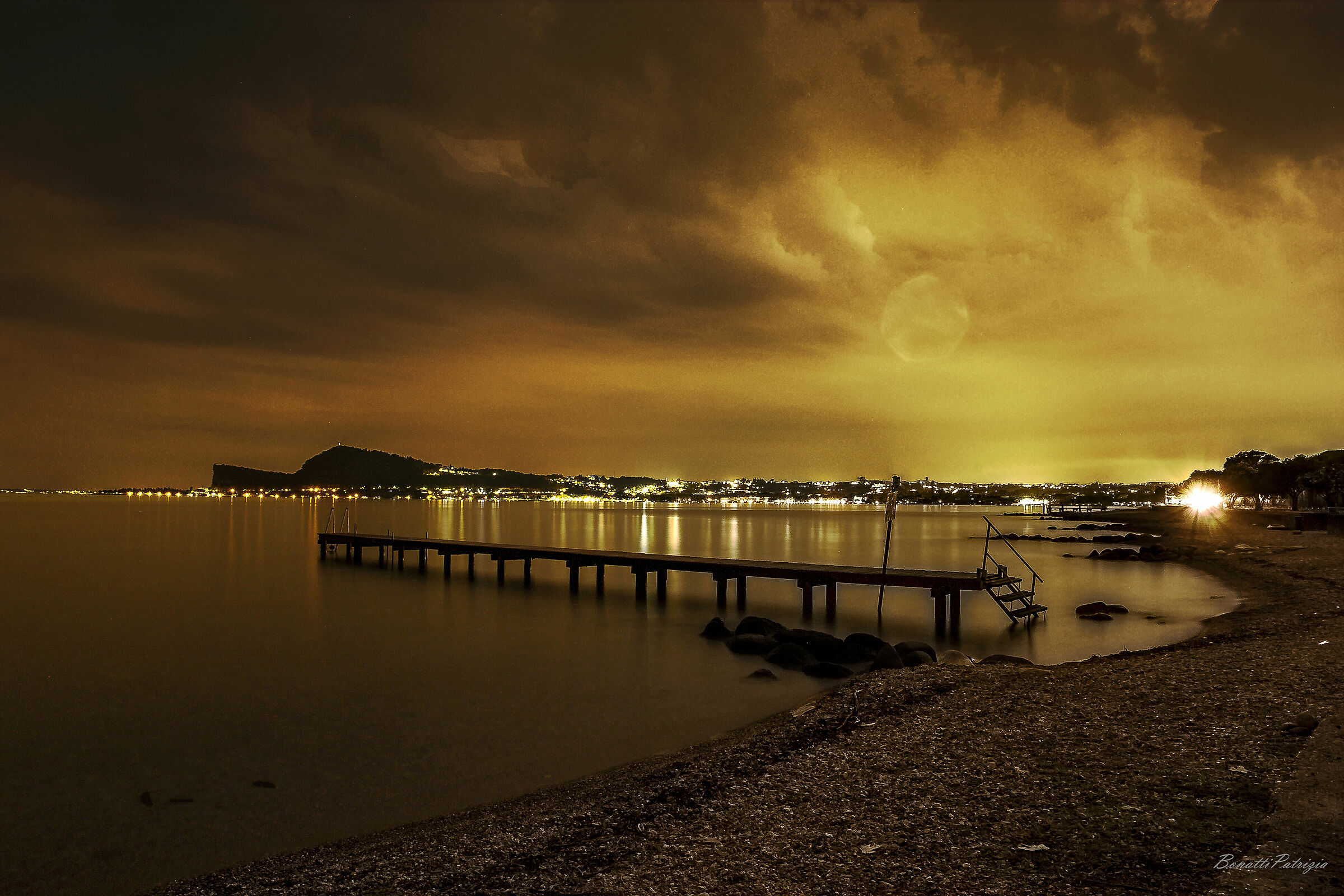 gleams in the night on the Garda