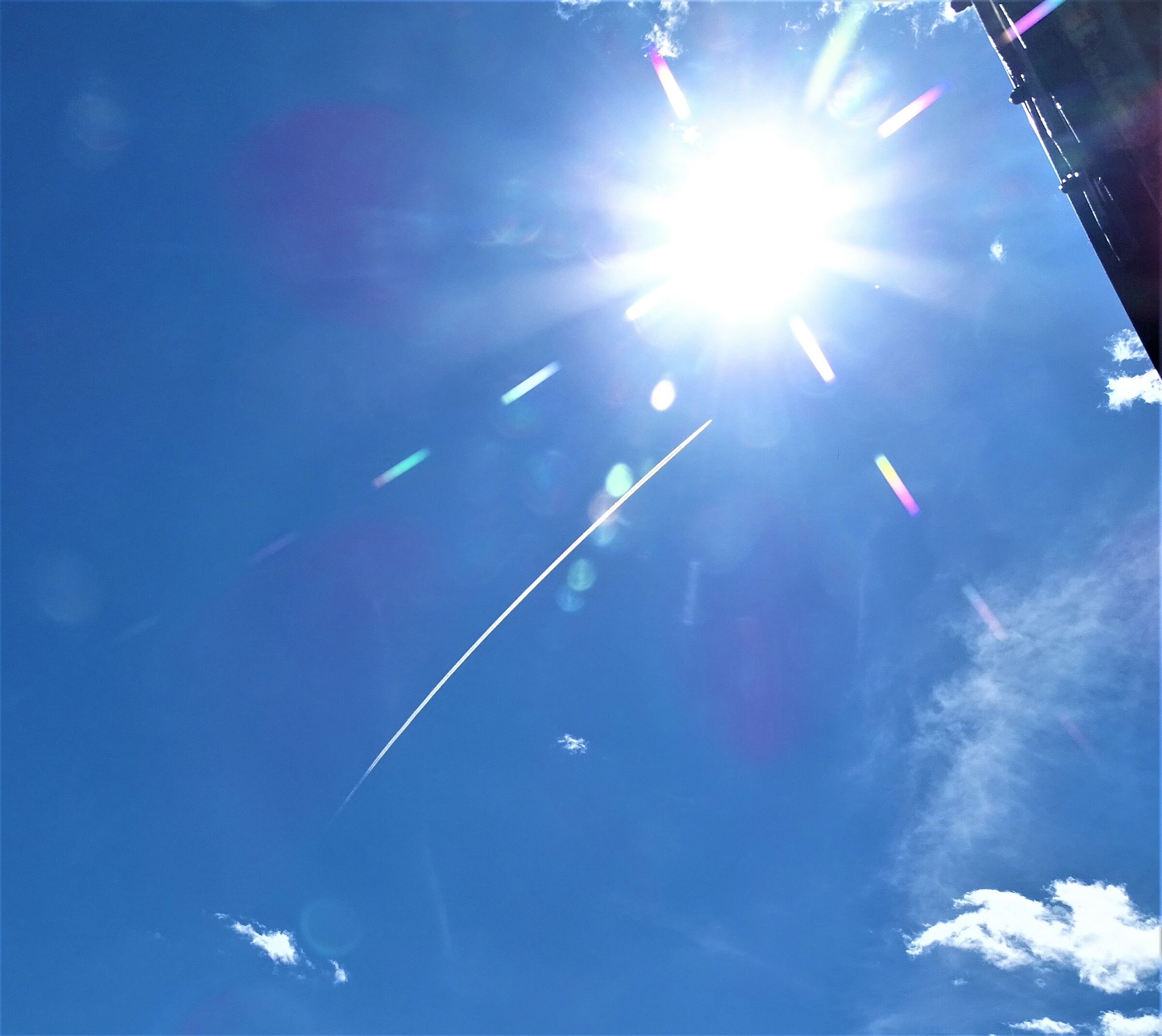 The July sun and the passing plane...