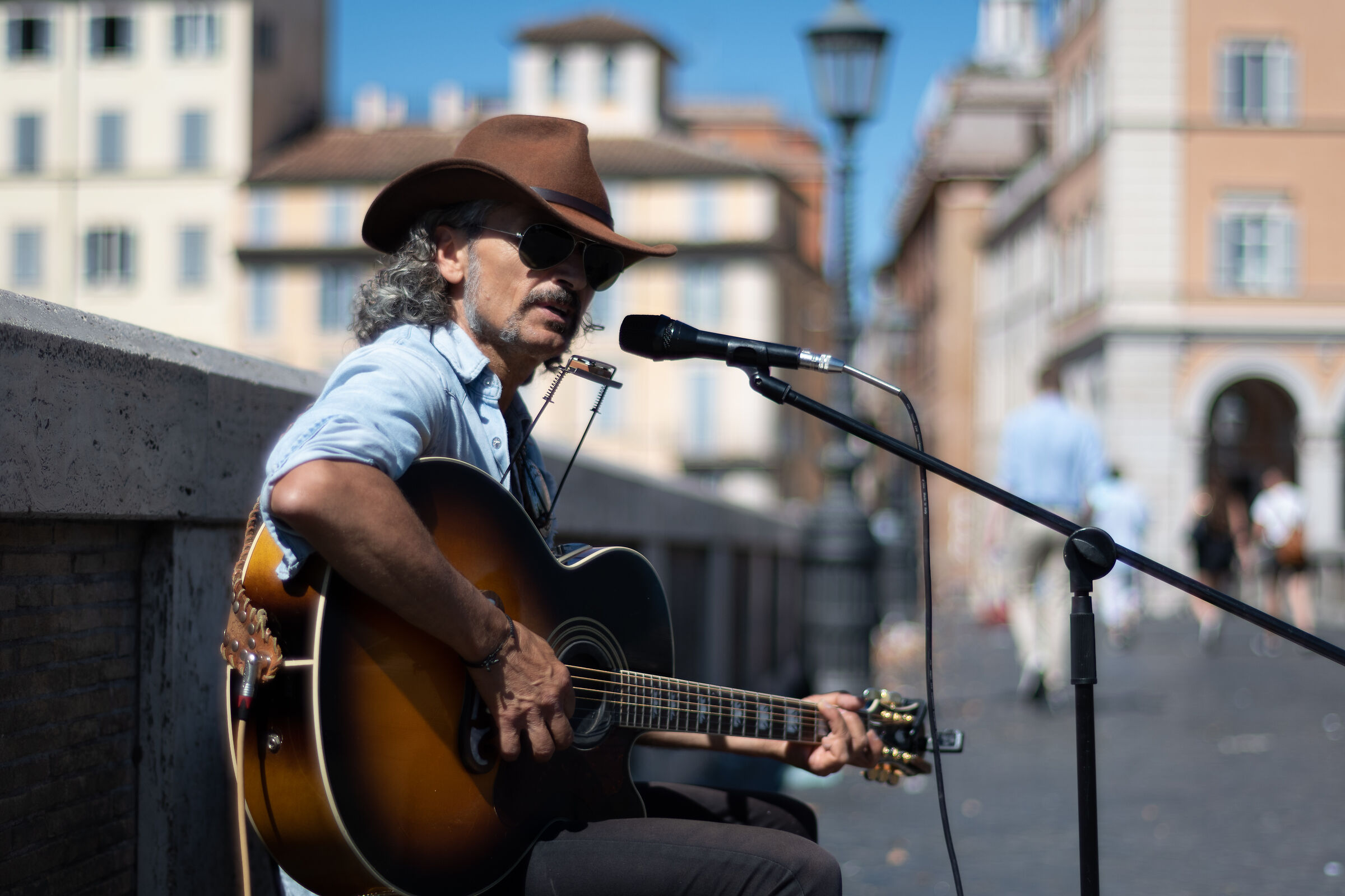 Guitar man on bridge.