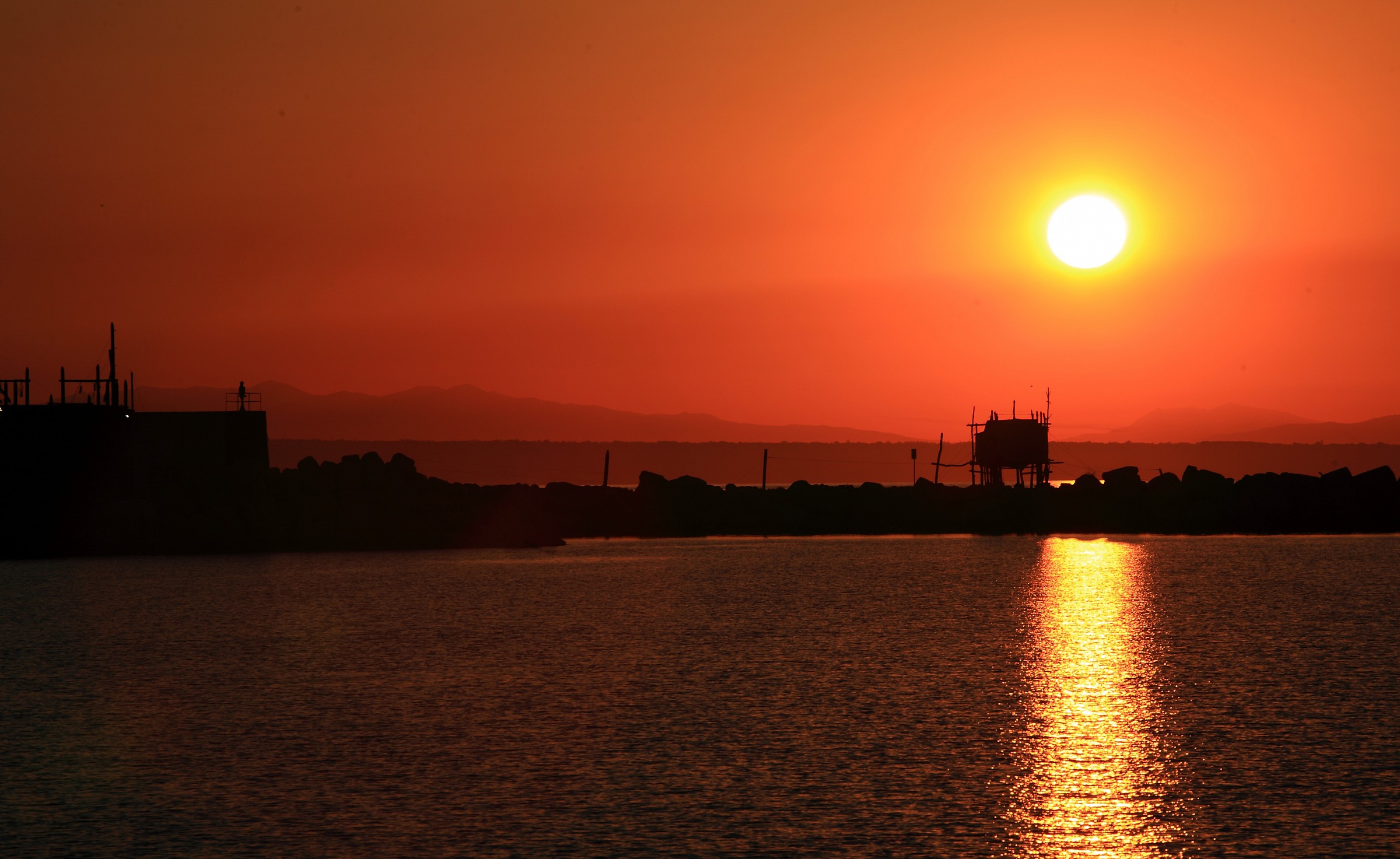 Sunset at the port of Punta Penna