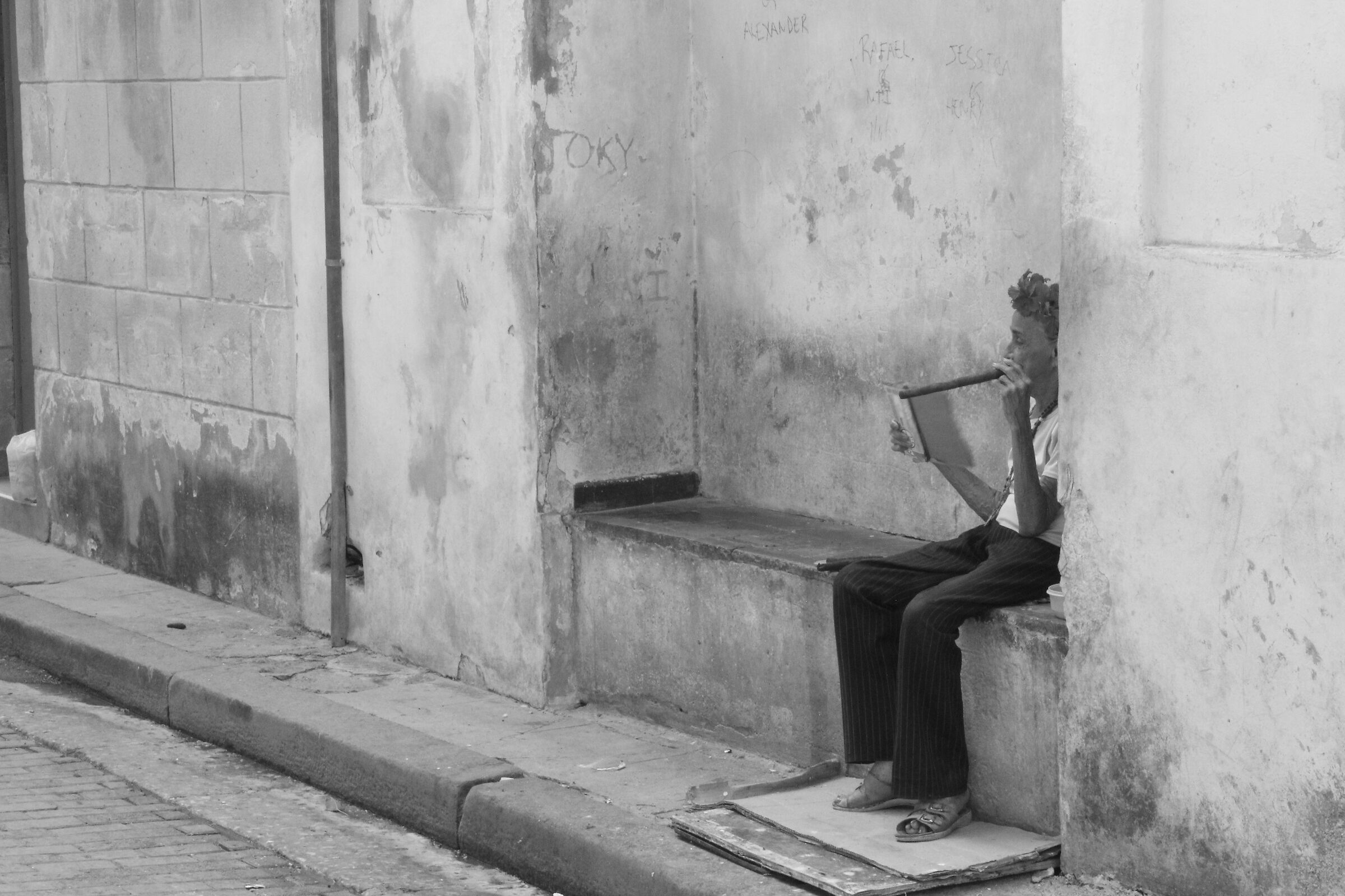 Woman smokes cigar in Havana