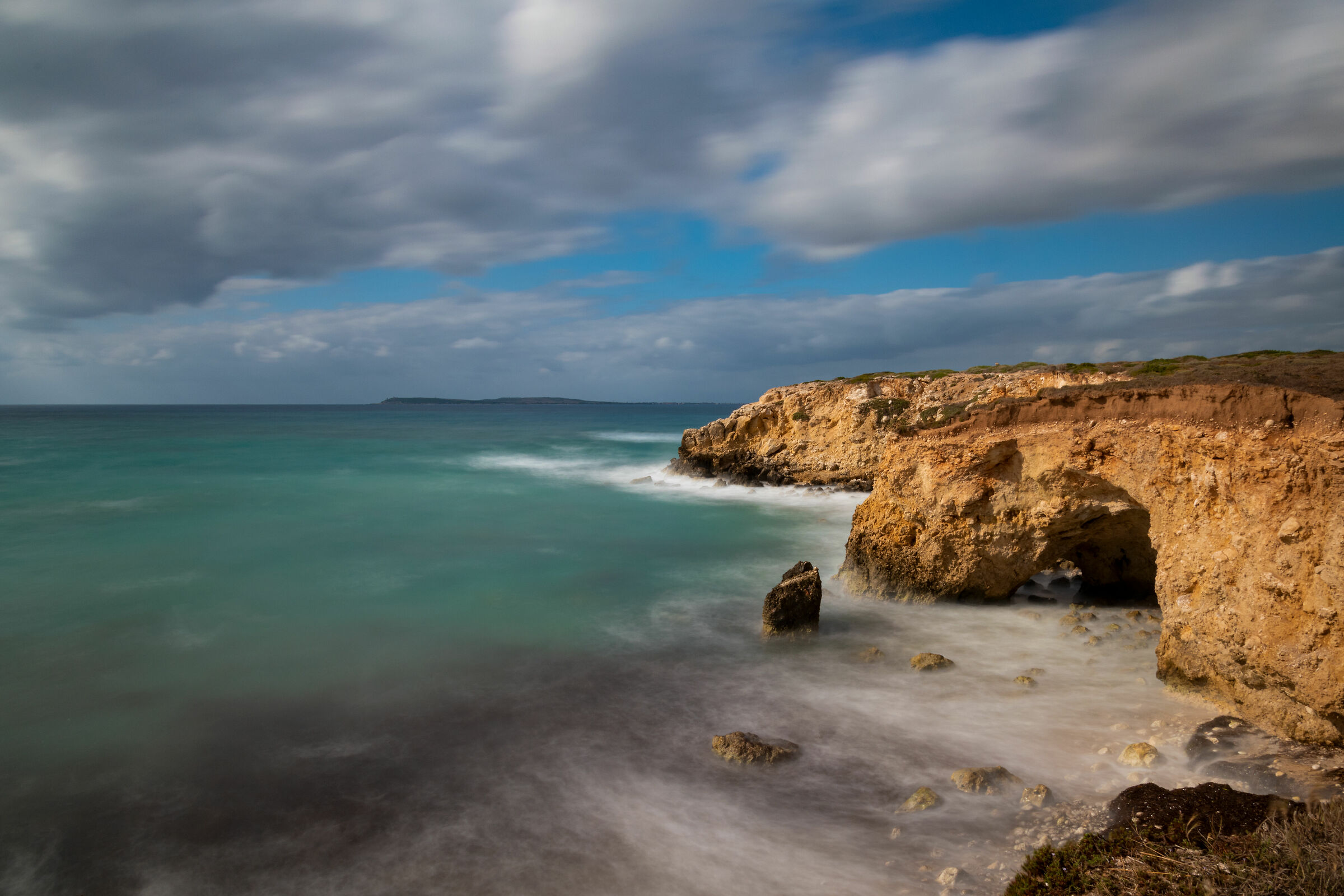Cliff with rough seas