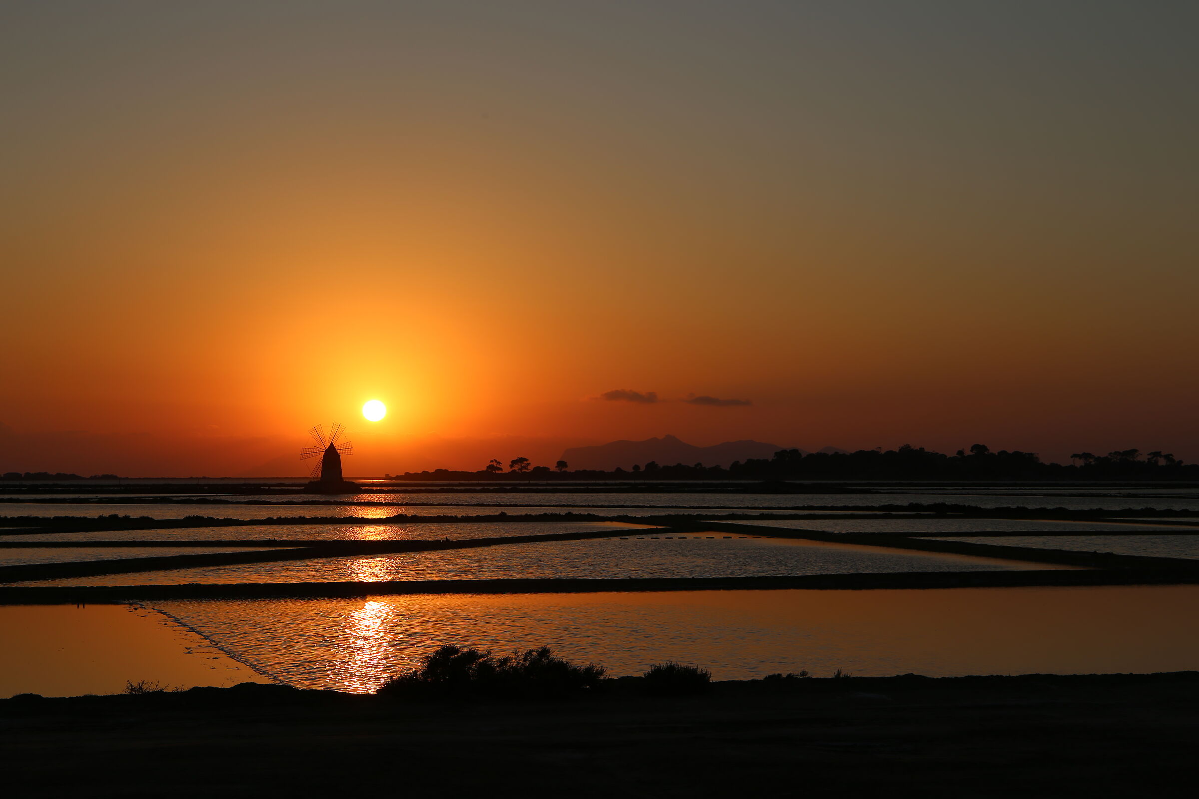 Sunset at the salt flats of the Marsala lagoon