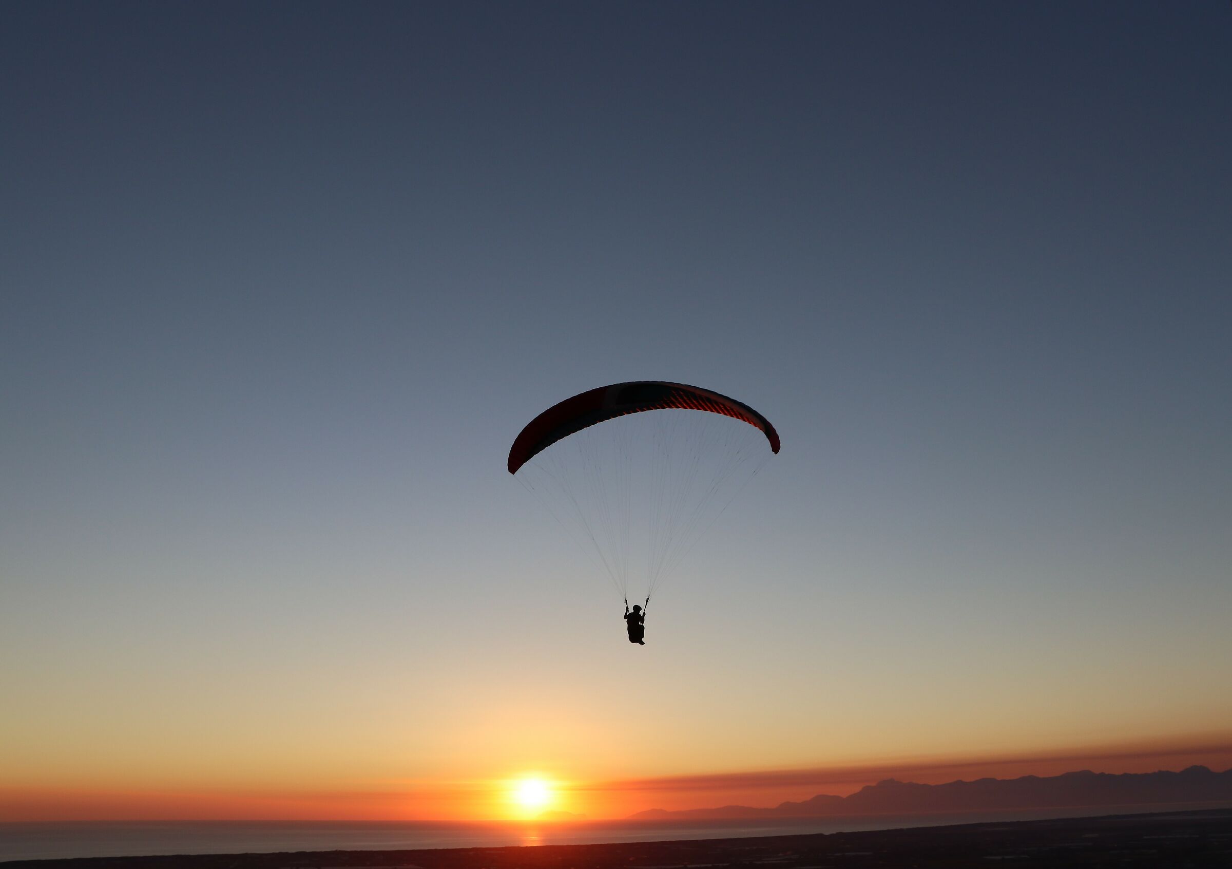 Paragliding at sunset